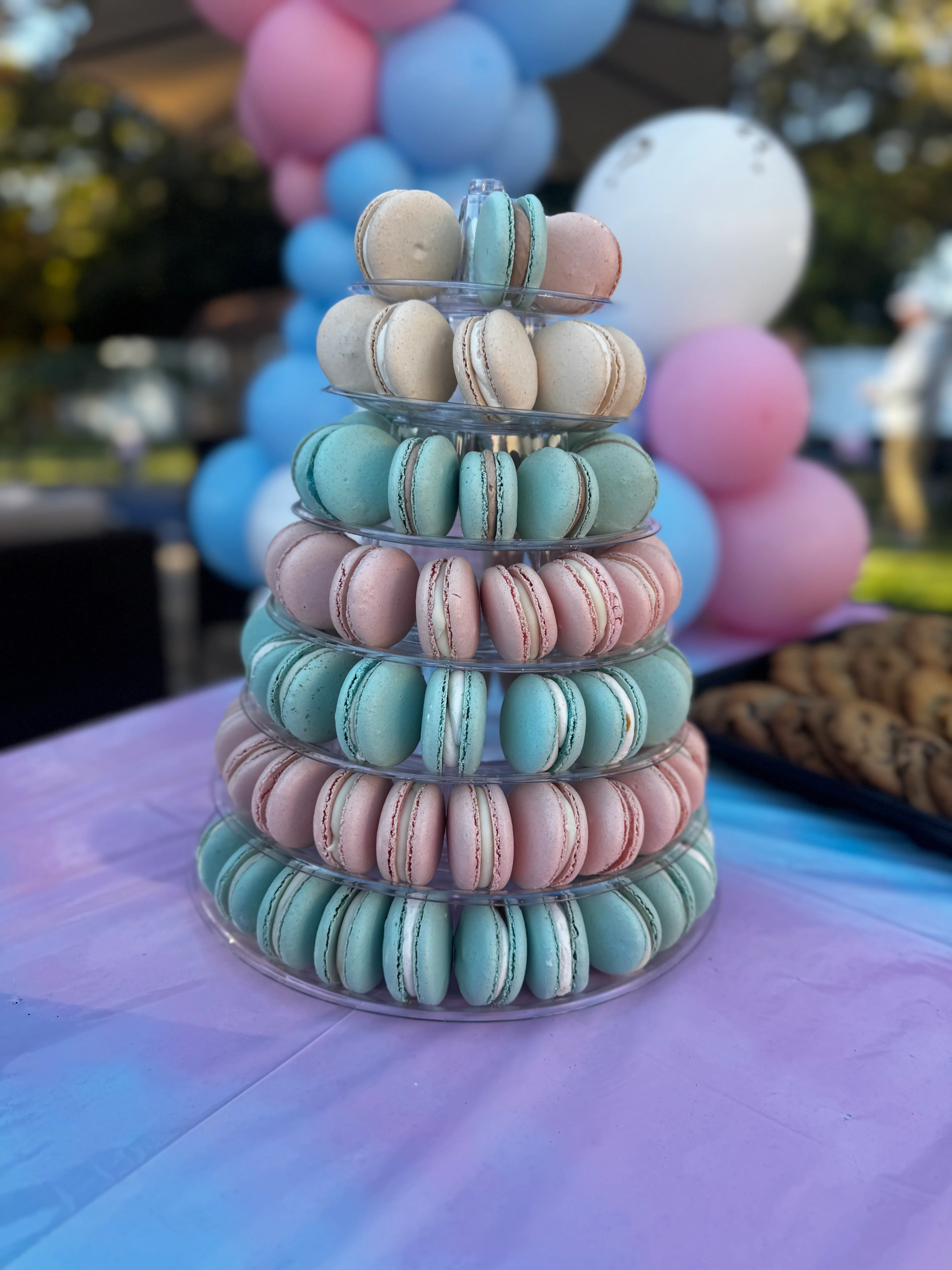 Colorful French macarons displayed in a tiered stand