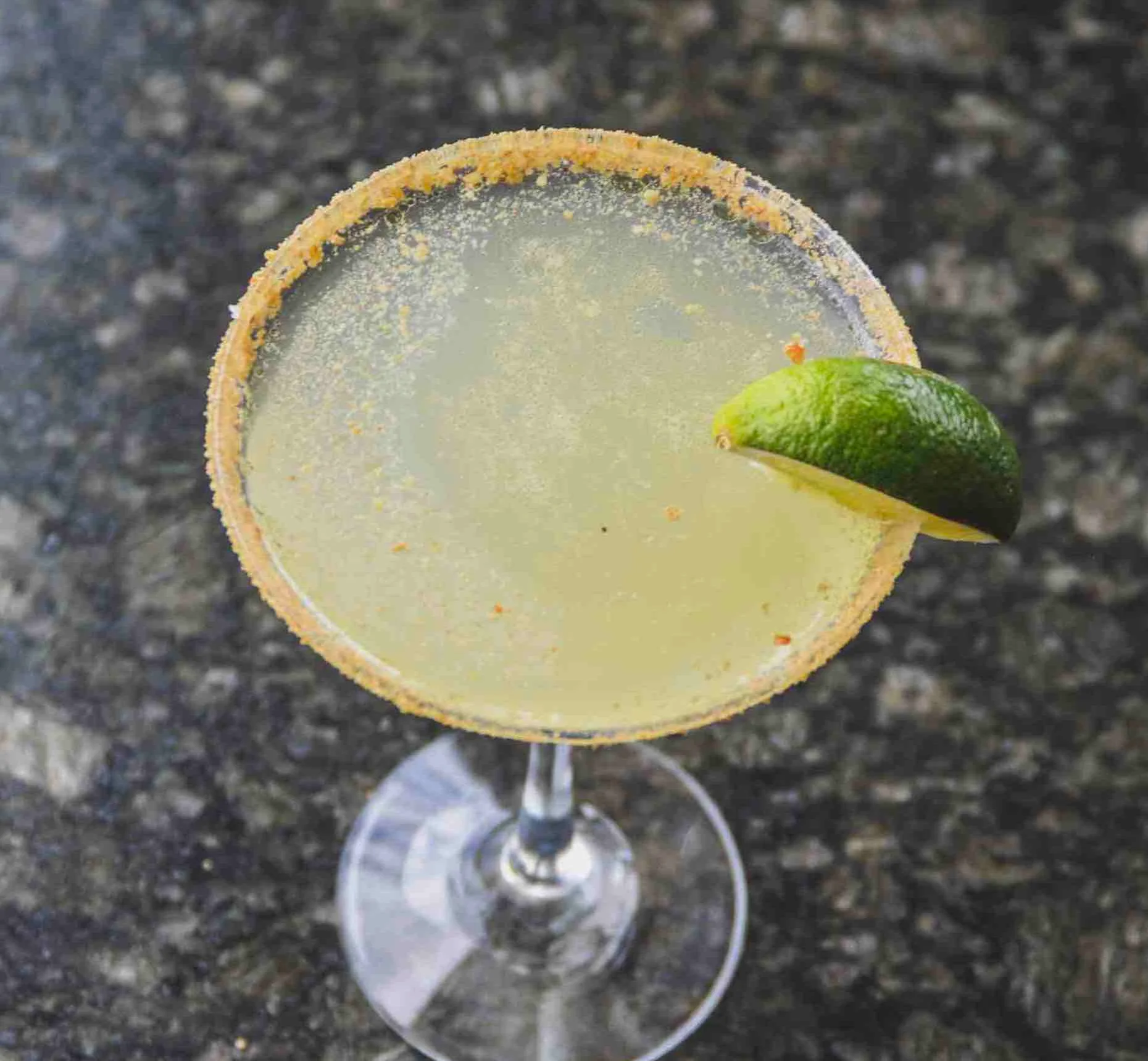 Key Lime Pie martini with a graham cracker rim and lime slice