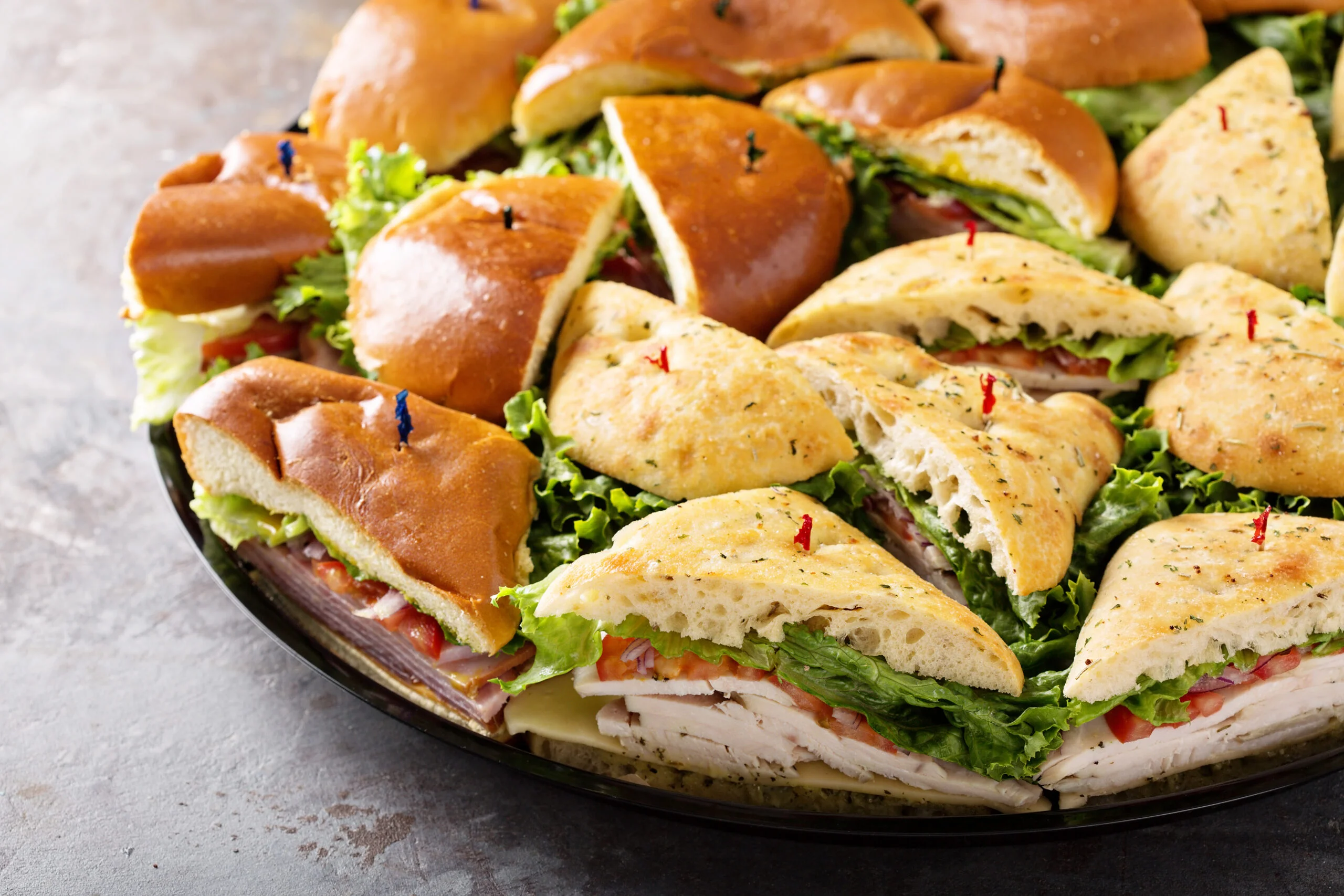 A beautifully arranged catering spread with various dishes and garnishes.