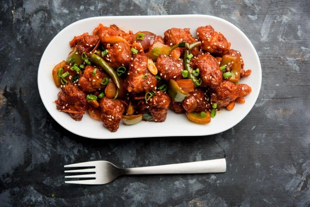 Sweet and sour Chinese General Tso's chicken with vegetables