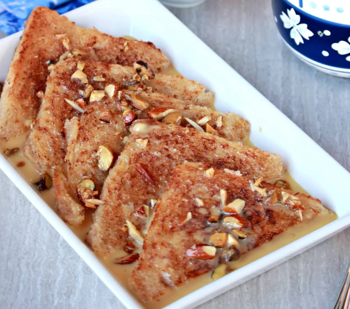 Indian bread pudding with nuts and sweet sauce