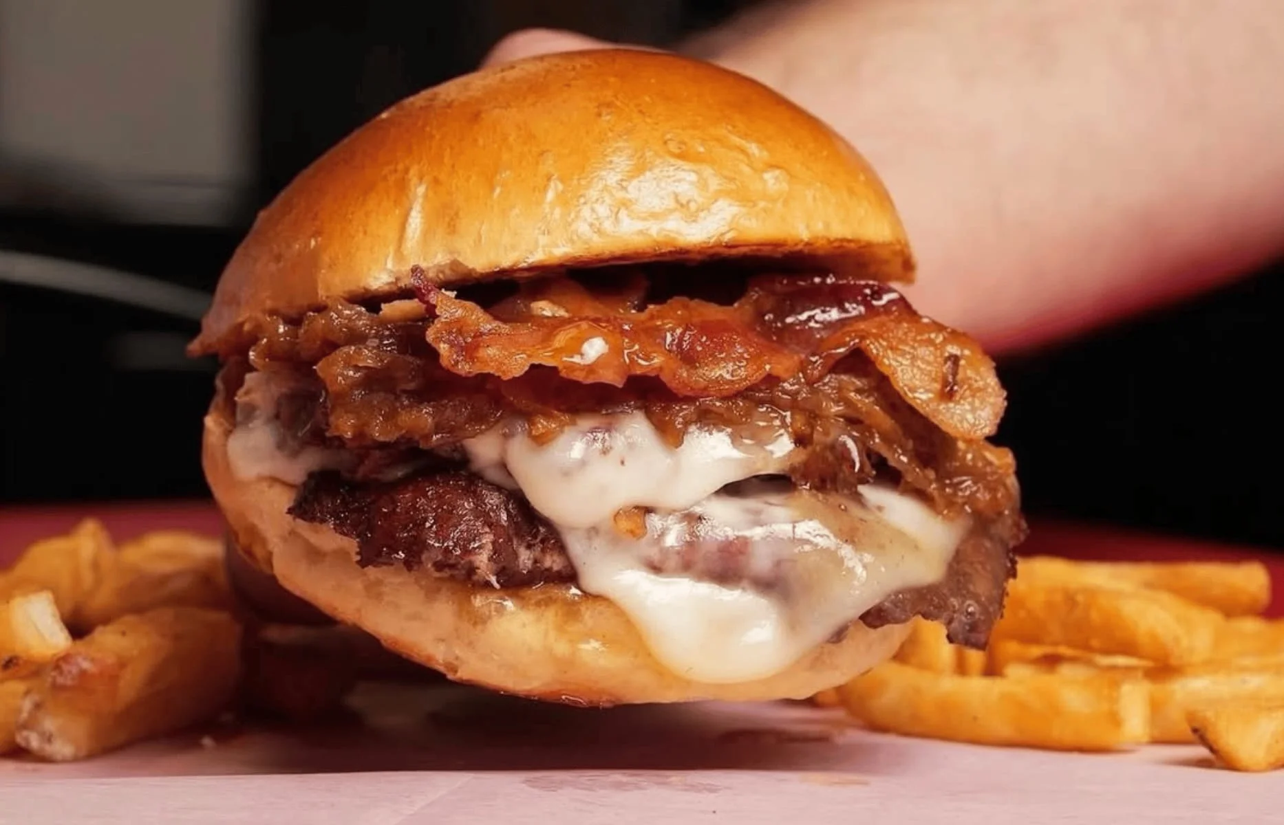 Juicy cheeseburger with crispy bacon and melted cheese