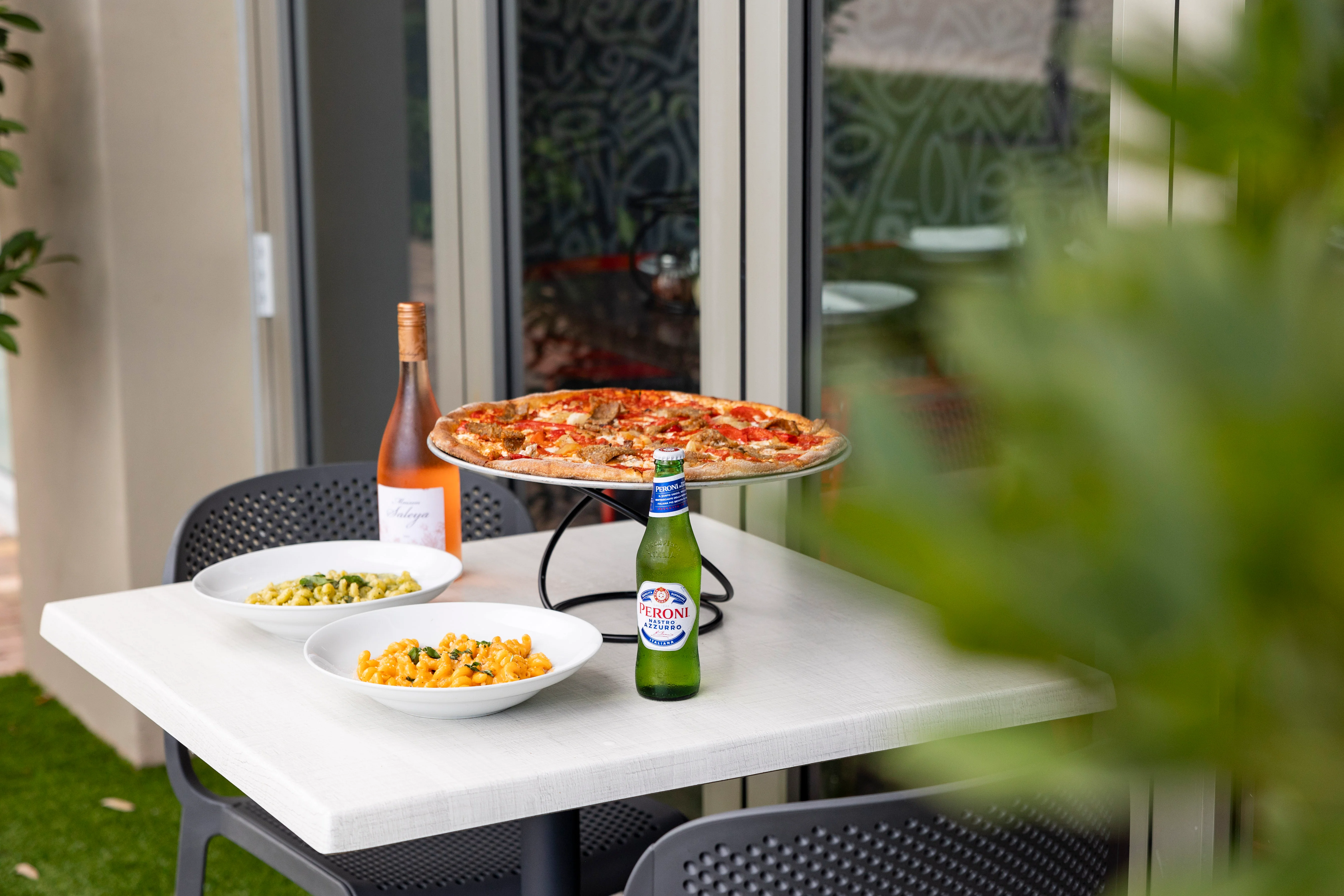 Italian pizza with fresh toppings on a restaurant table