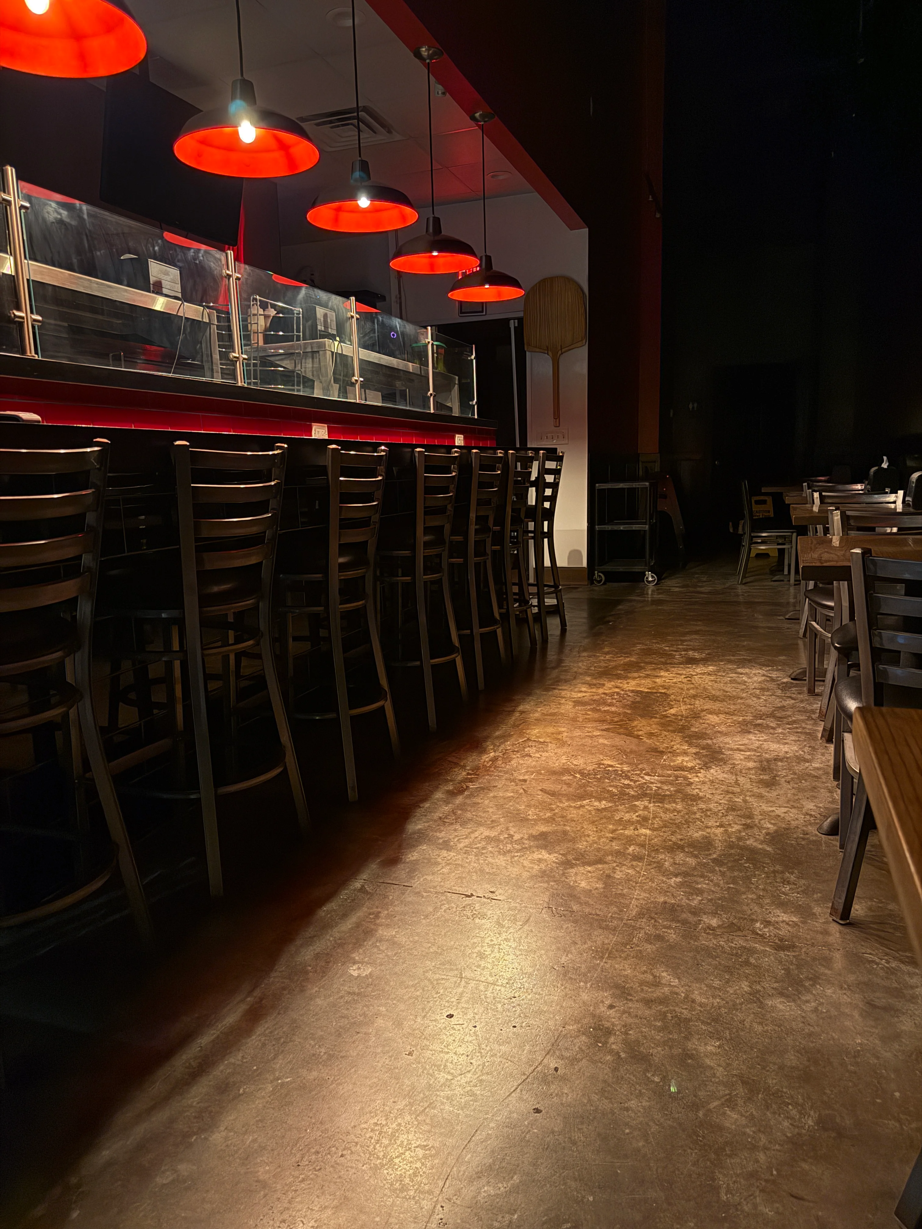 Cozy restaurant interior with red pendant lights