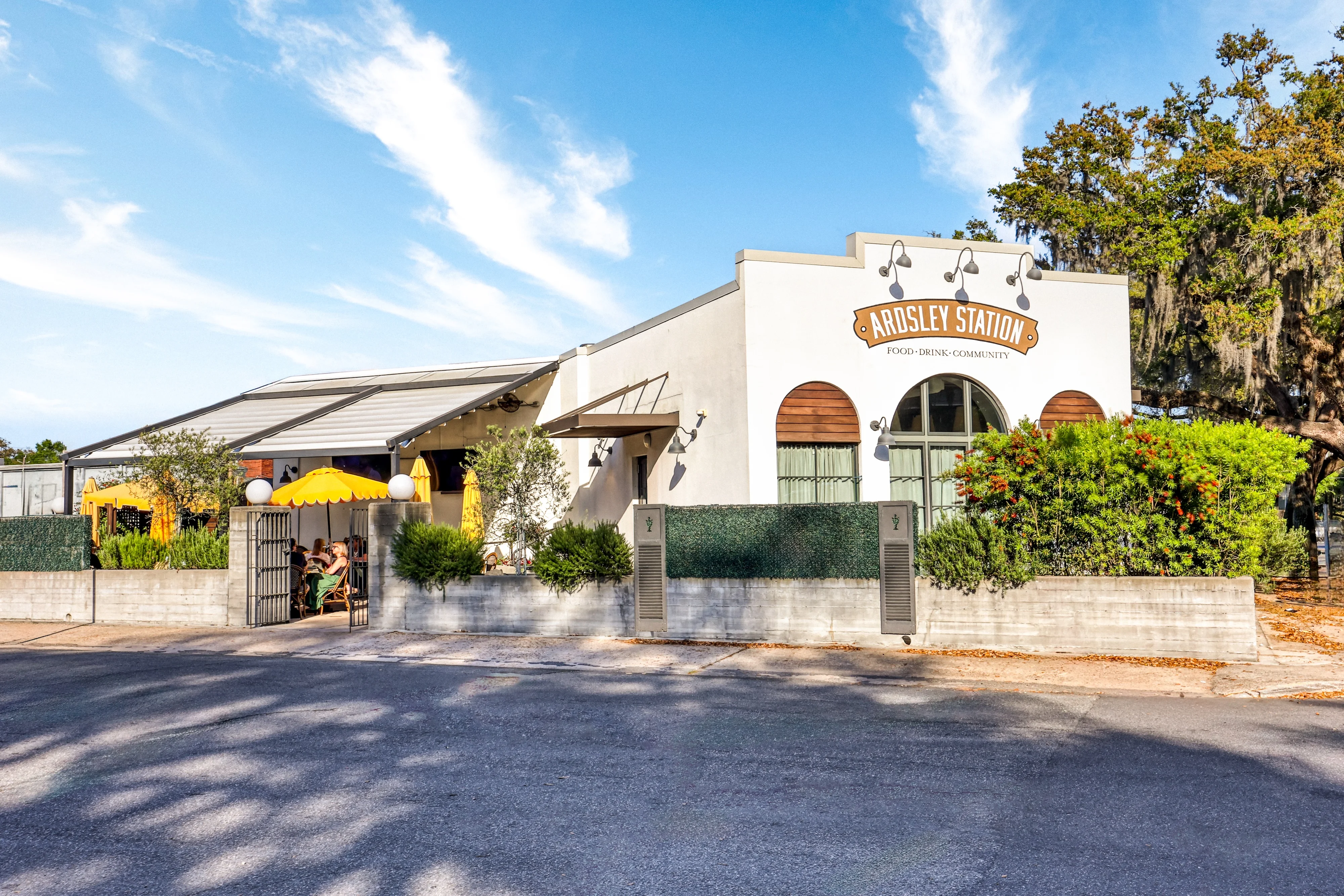 Charming restaurant exterior with outdoor seating and vibrant umbrellas