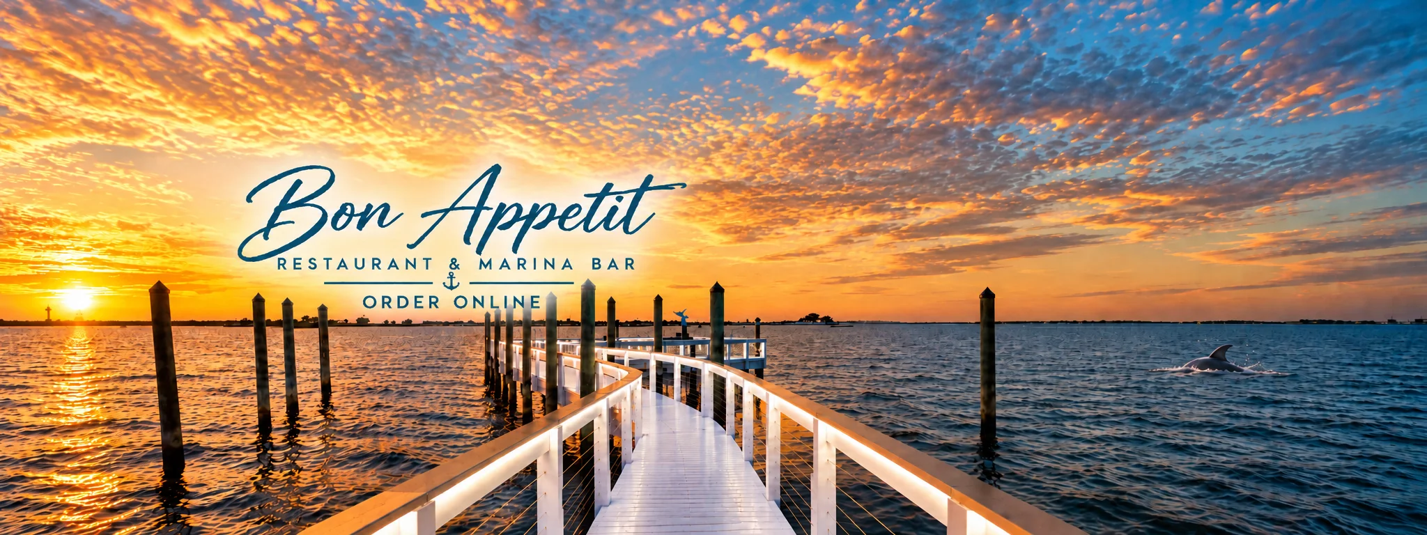Scenic marina view at sunset with wooden walkway and water reflections