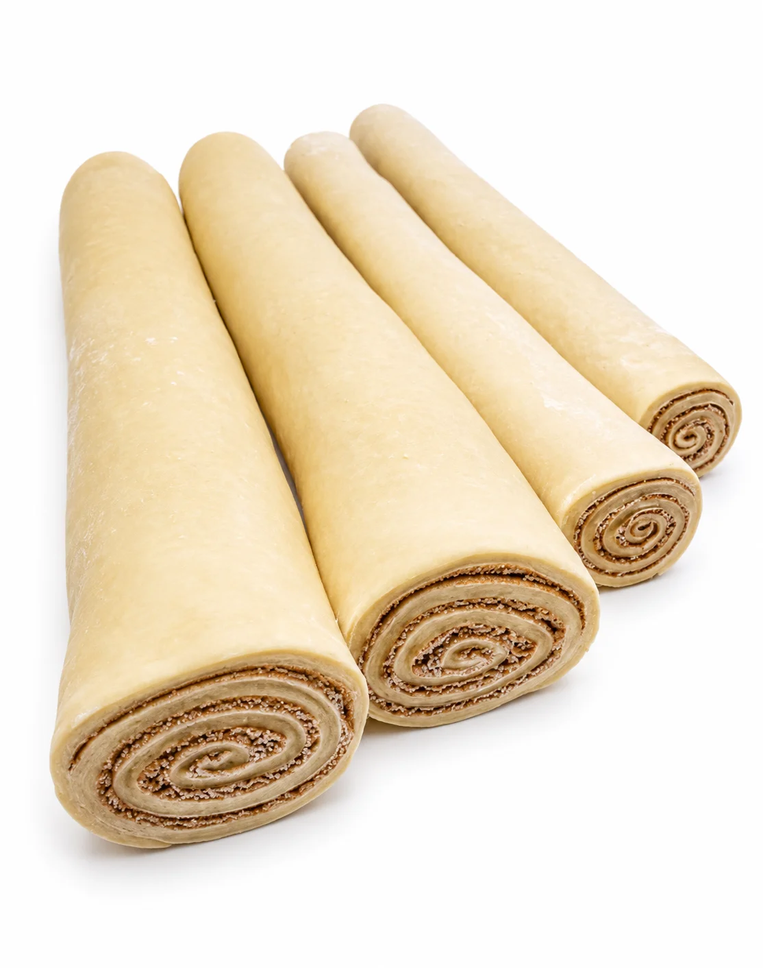 Four rolled snacks with a creamy yellow exterior and chocolate swirls.