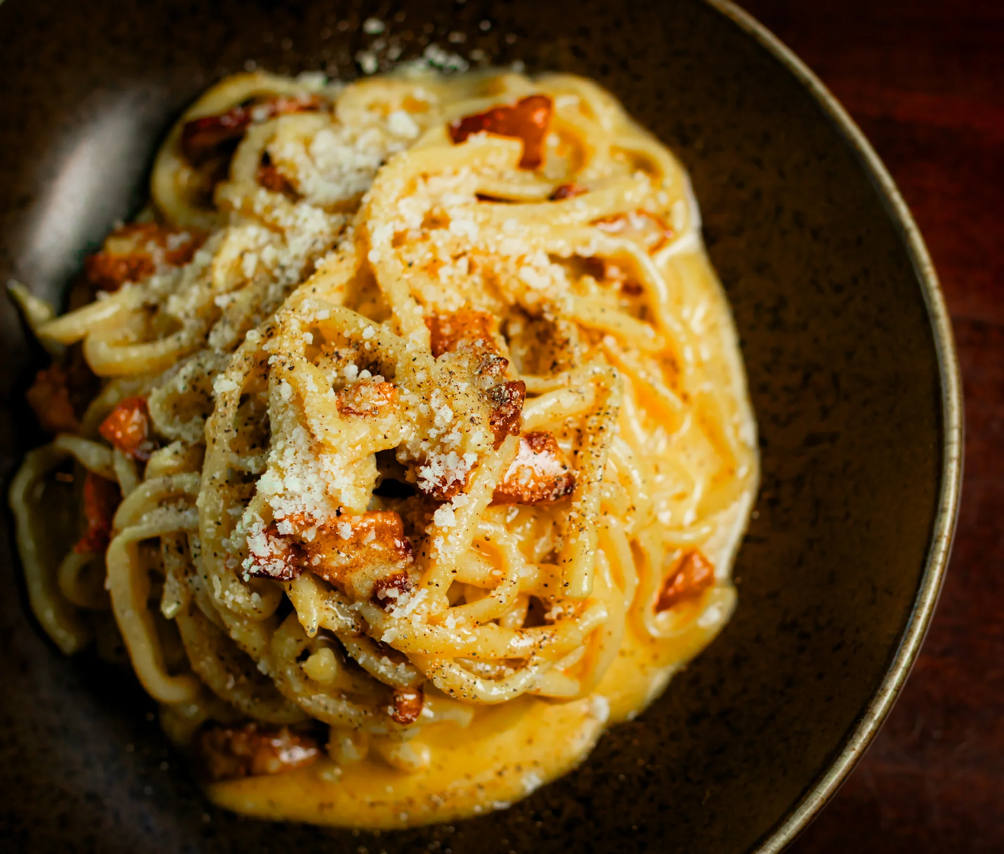Creamy spaghetti carbonara in a rustic bowl