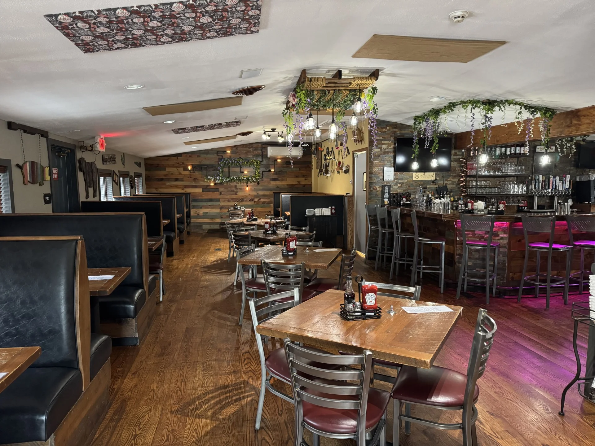 Cozy restaurant interior with wooden decor and bar seating