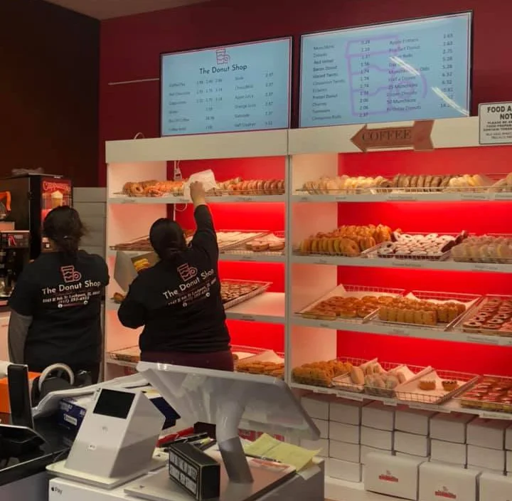 Display of assorted donuts in a vibrant bakery