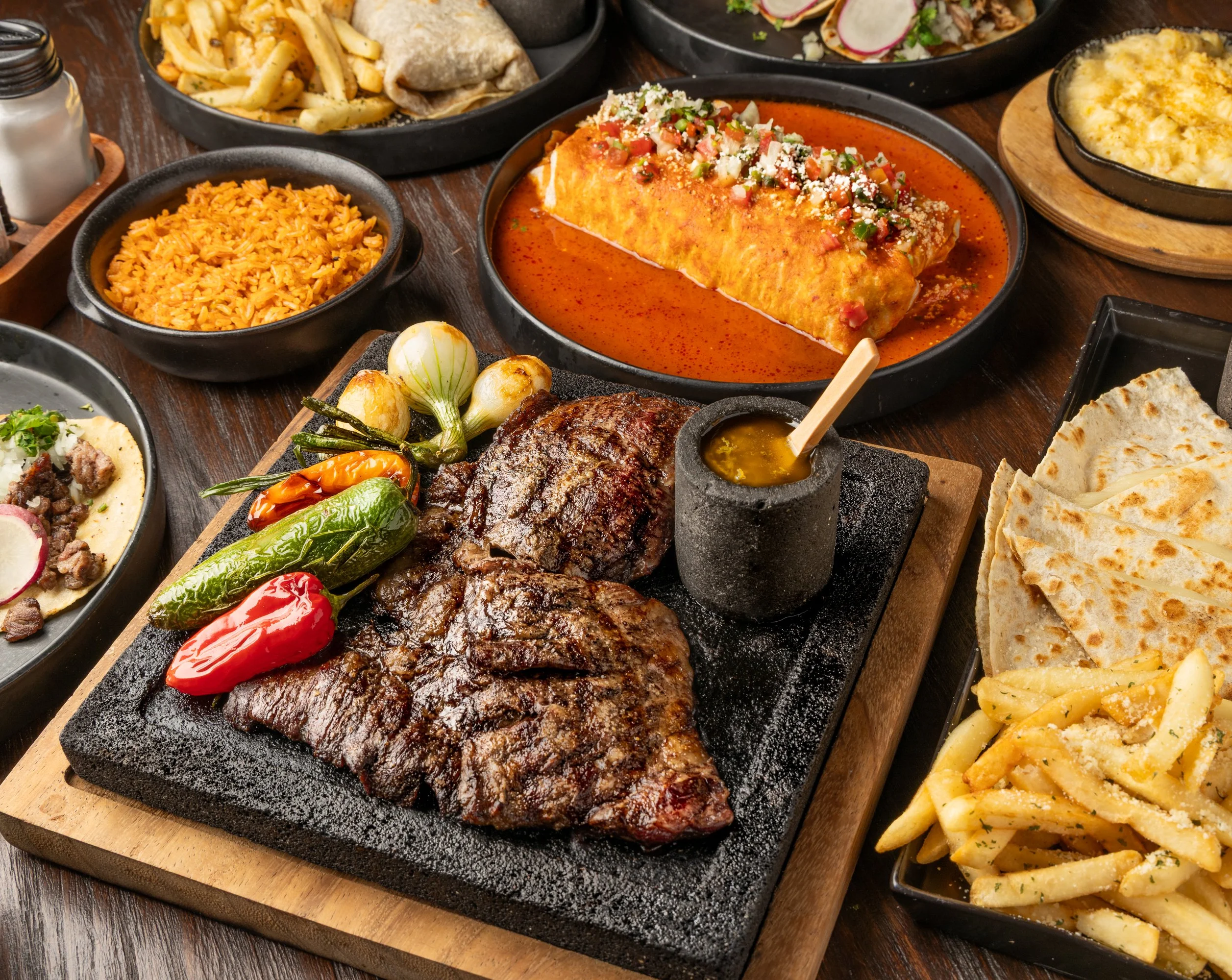 Sizzling fajitas served on a hot stone platter