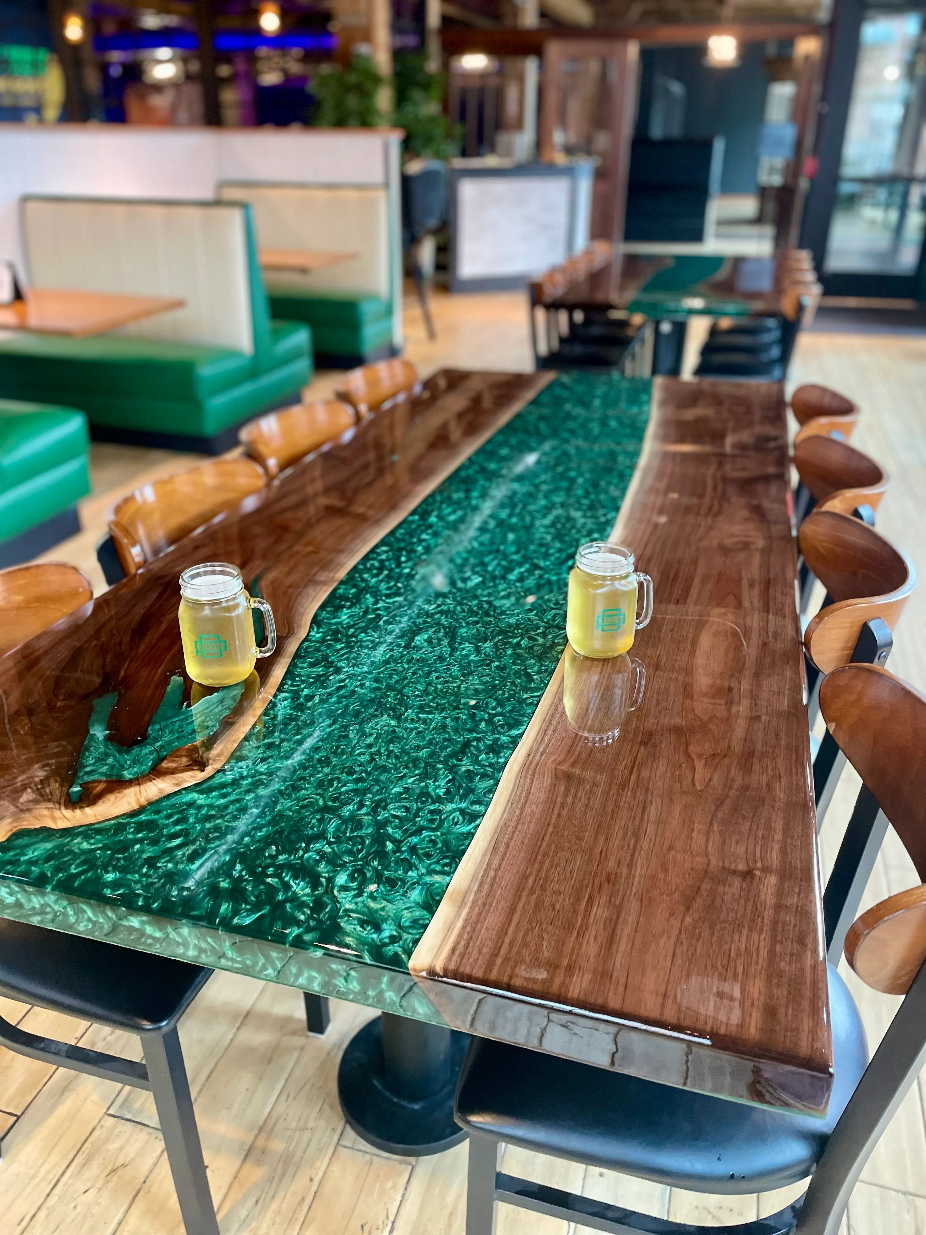 Stylish restaurant interior with a unique wooden table and drinks