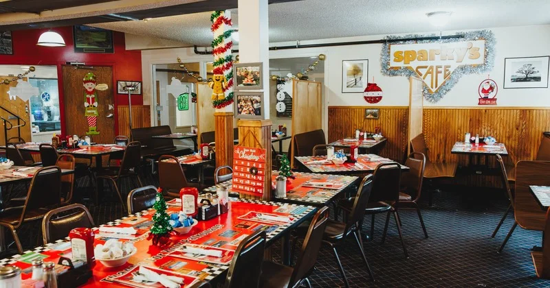 Cozy diner interior with festive decor and tables set for dining