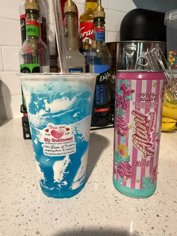 Colorful drink with cotton candy flavor and blue swirl, served in a cup