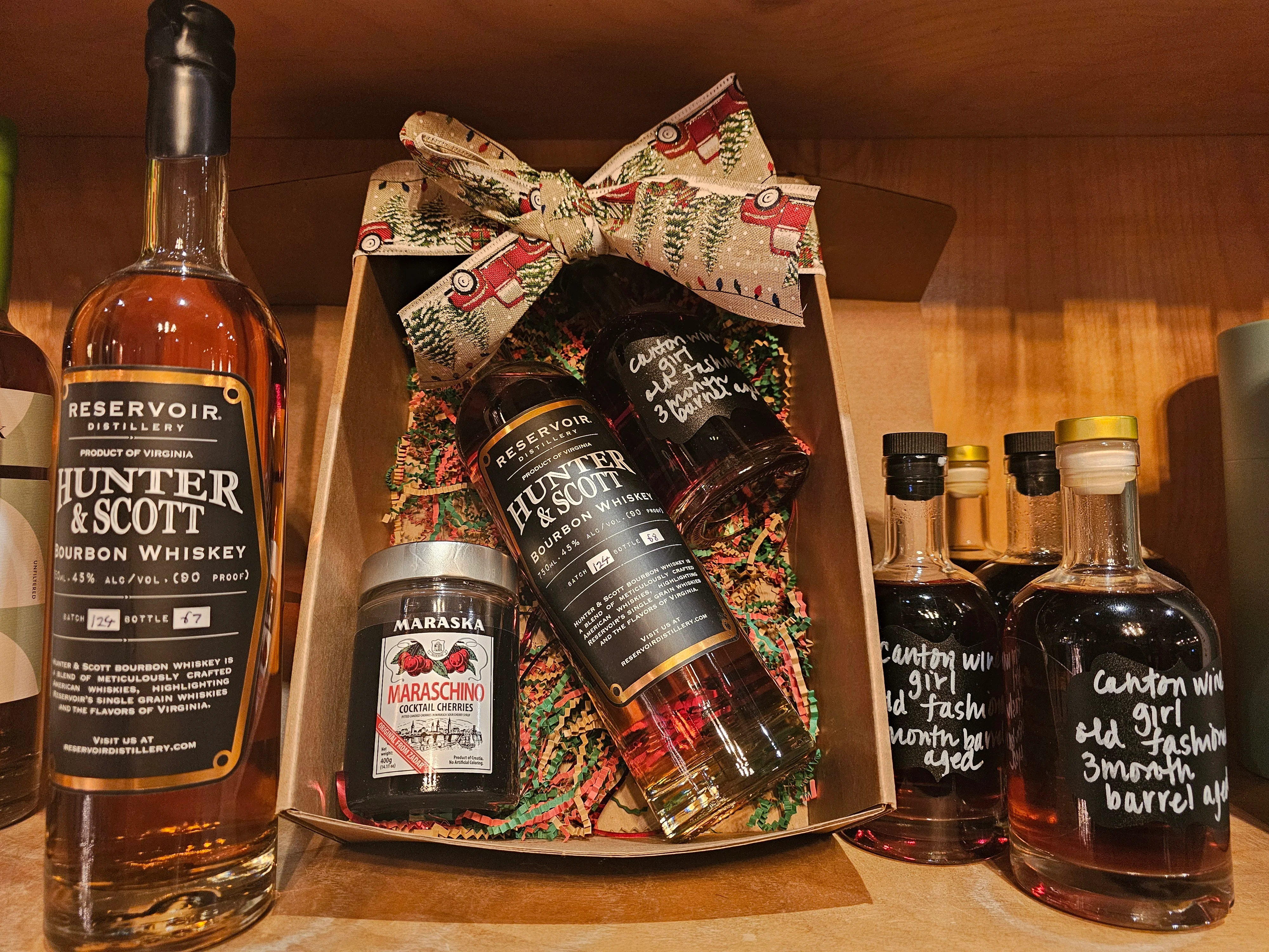 Gift box with bourbon whiskey and cocktail cherries