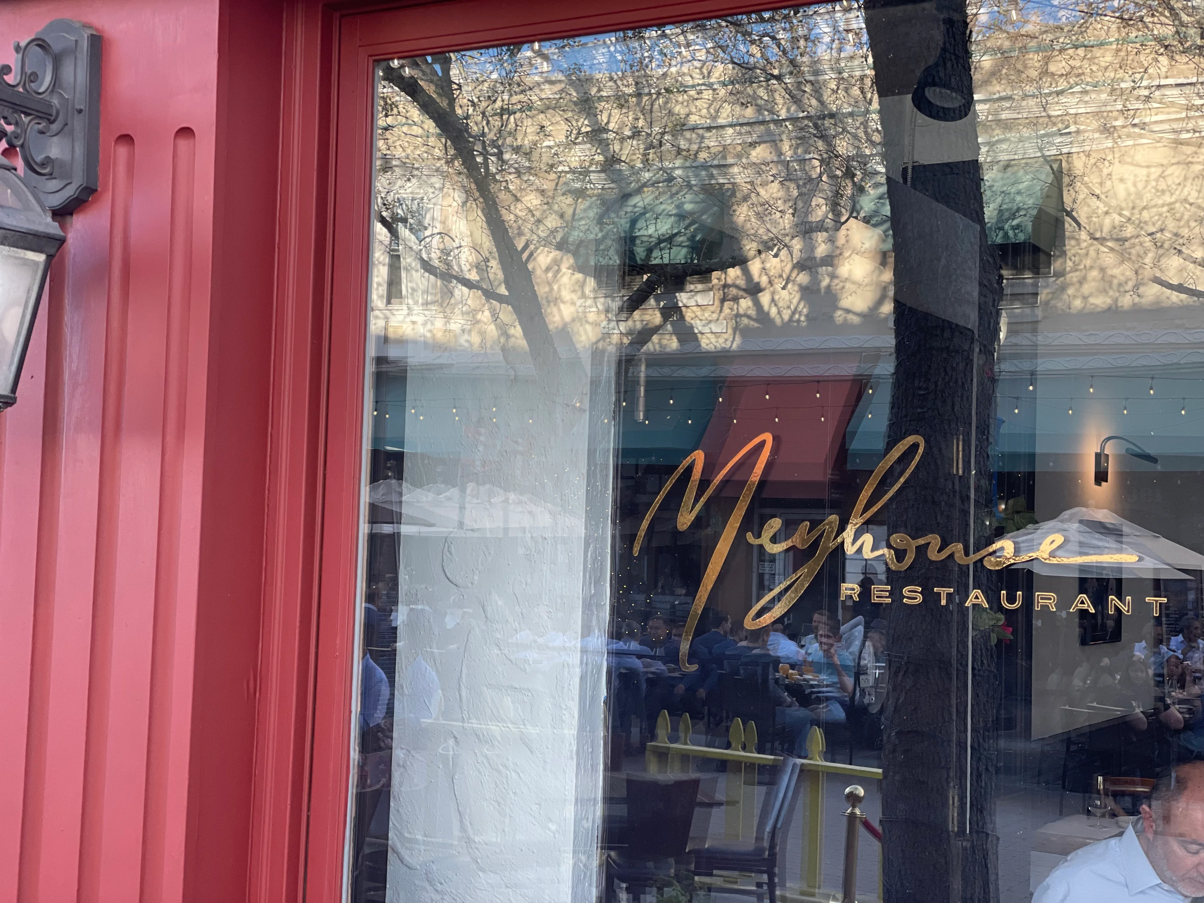 Exterior view of Meyhouse Restaurant with elegant signage