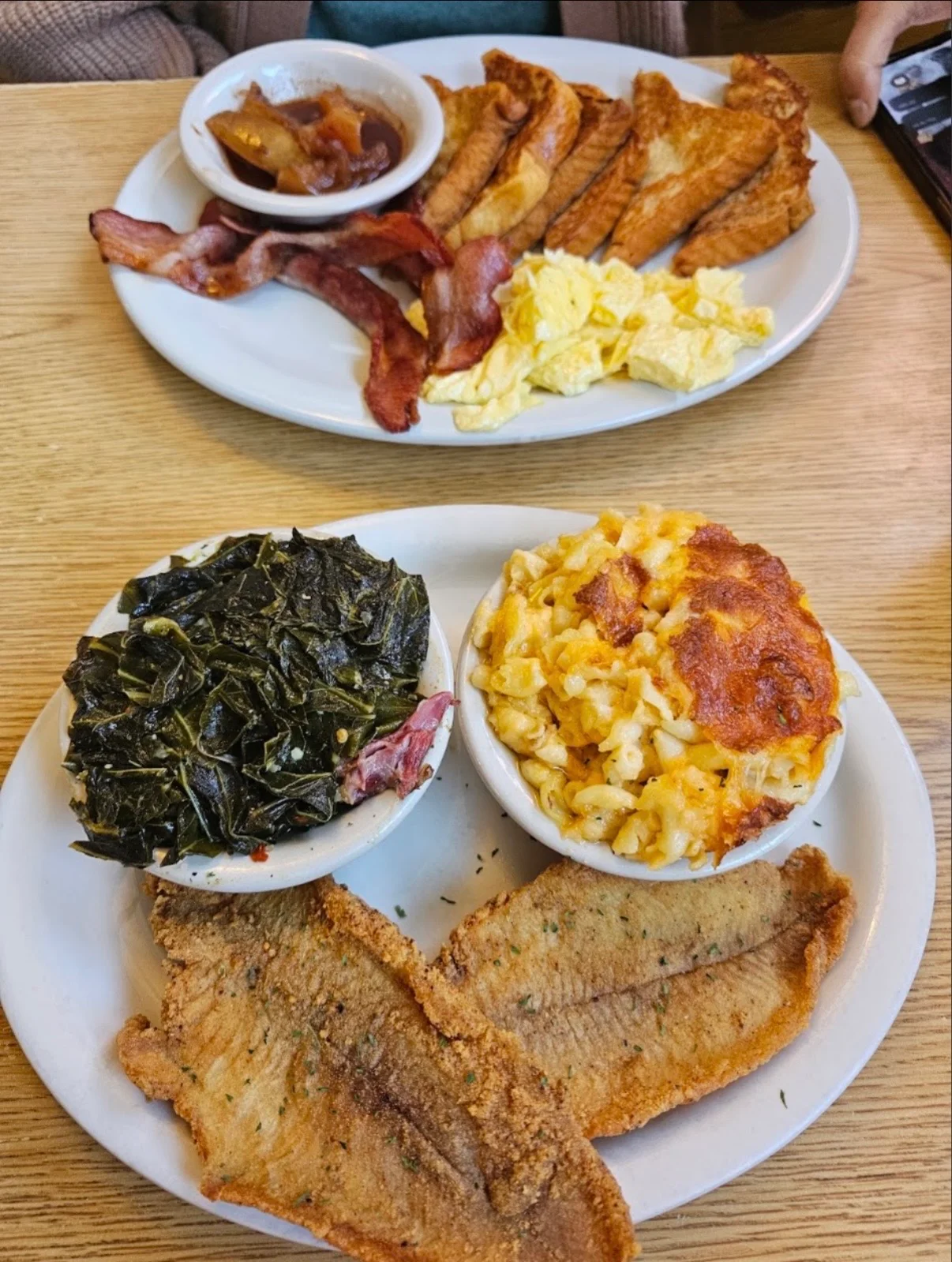 Southern soul food platter with fried fish, collard greens, and baked macaroni and cheese