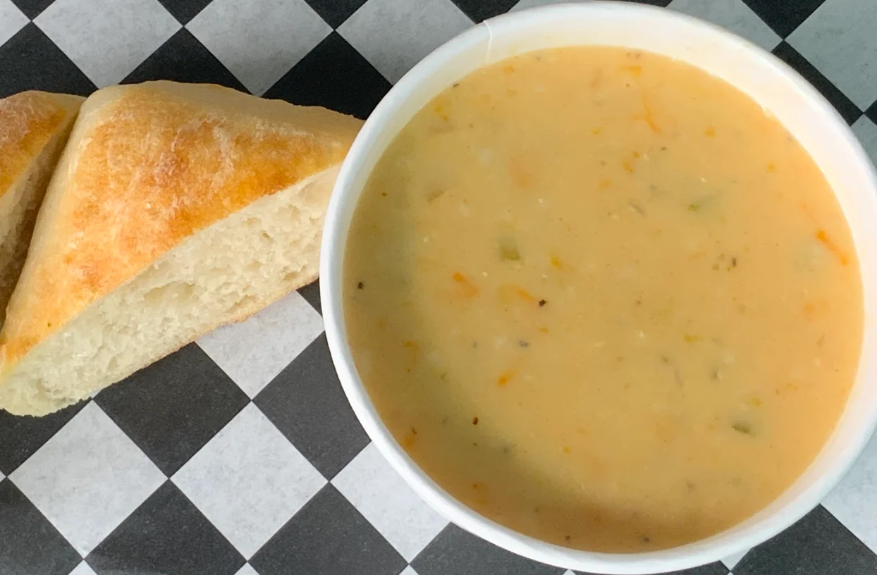 Italian Sausage and butternut squash soup with local Italian sausage simmered in a puree of onion, butternut squash, herbs, & cream and finished with roasted red pepper.