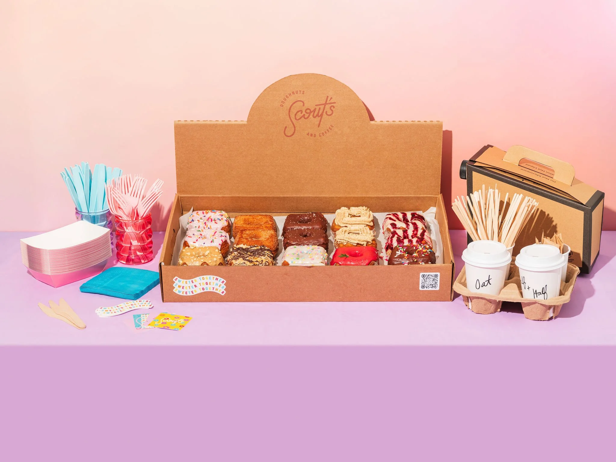 Colorful assortment of gourmet donuts in a box
