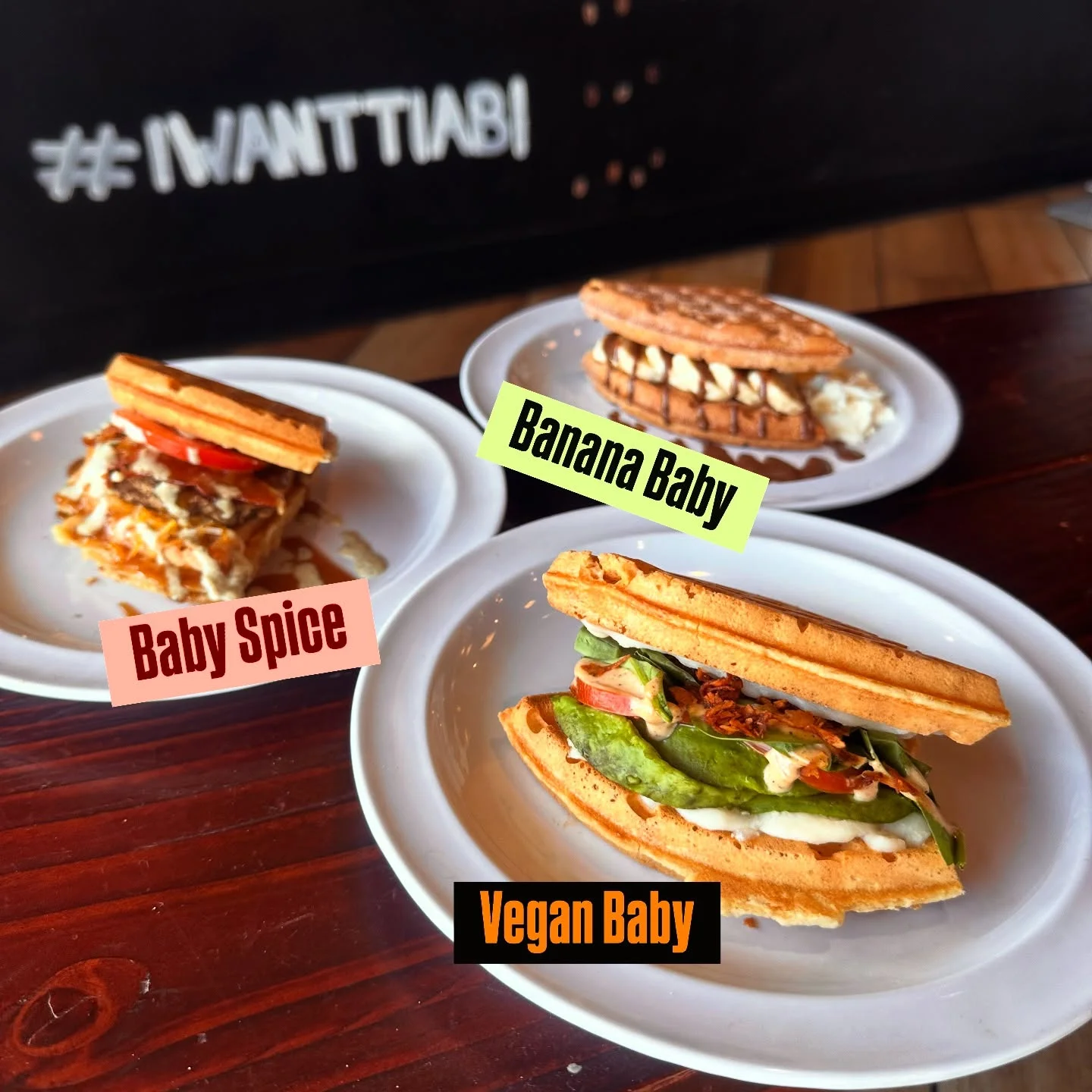Delicious gourmet burger with fresh toppings on a wooden table
