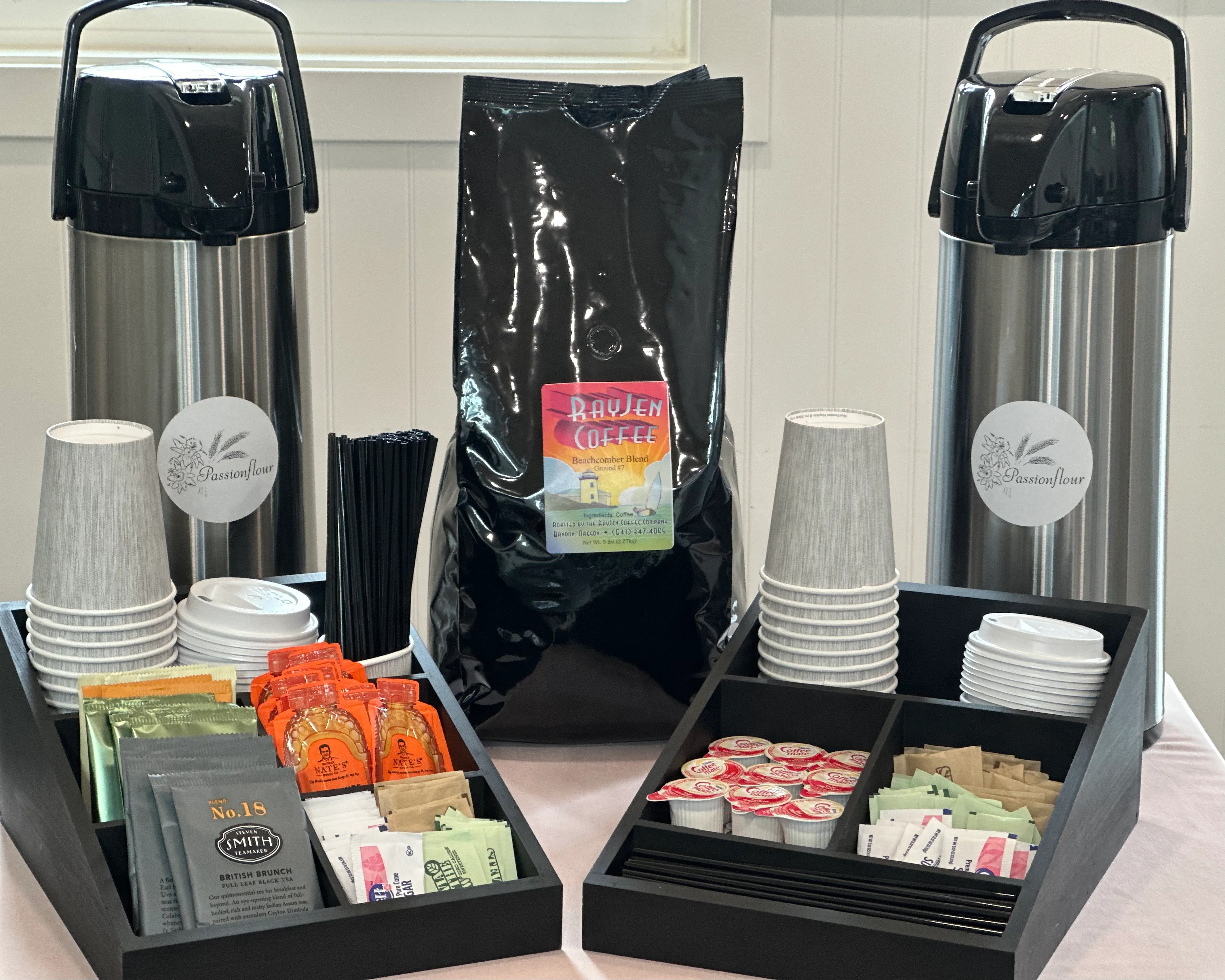 Coffee station setup with Raven Coffee and assorted condiments