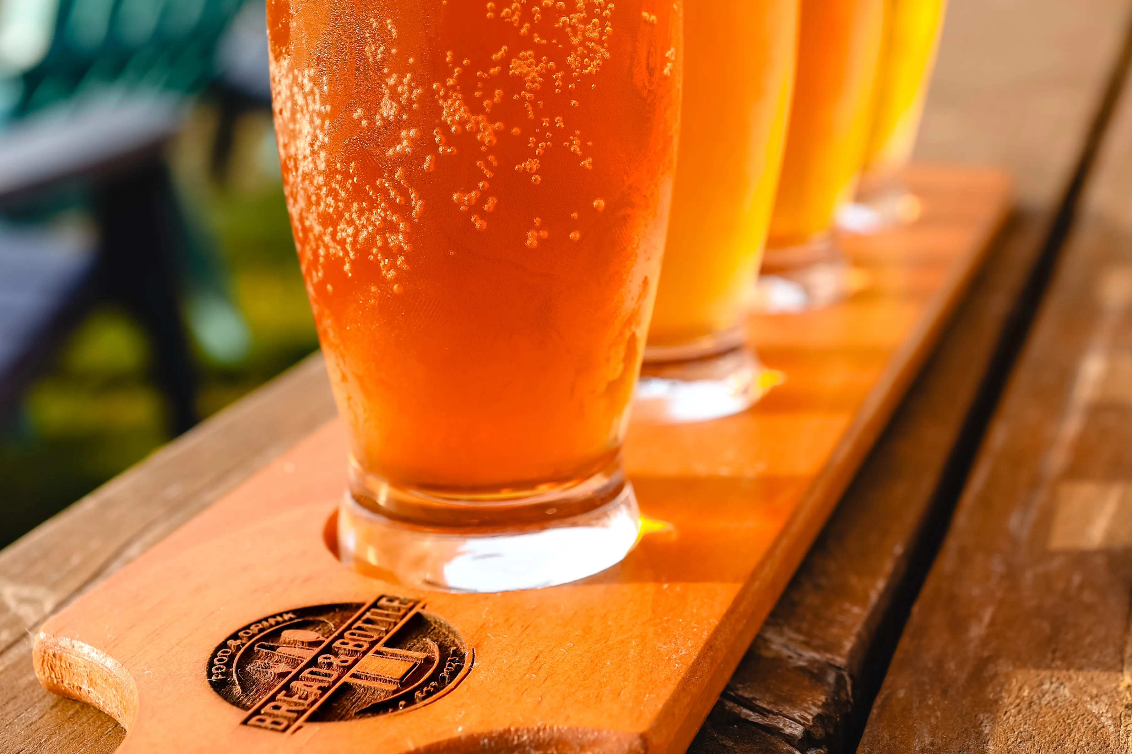 Craft beer flight served in a wooden paddle