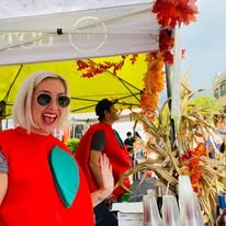 A vibrant display of fresh apples at an apple festival.