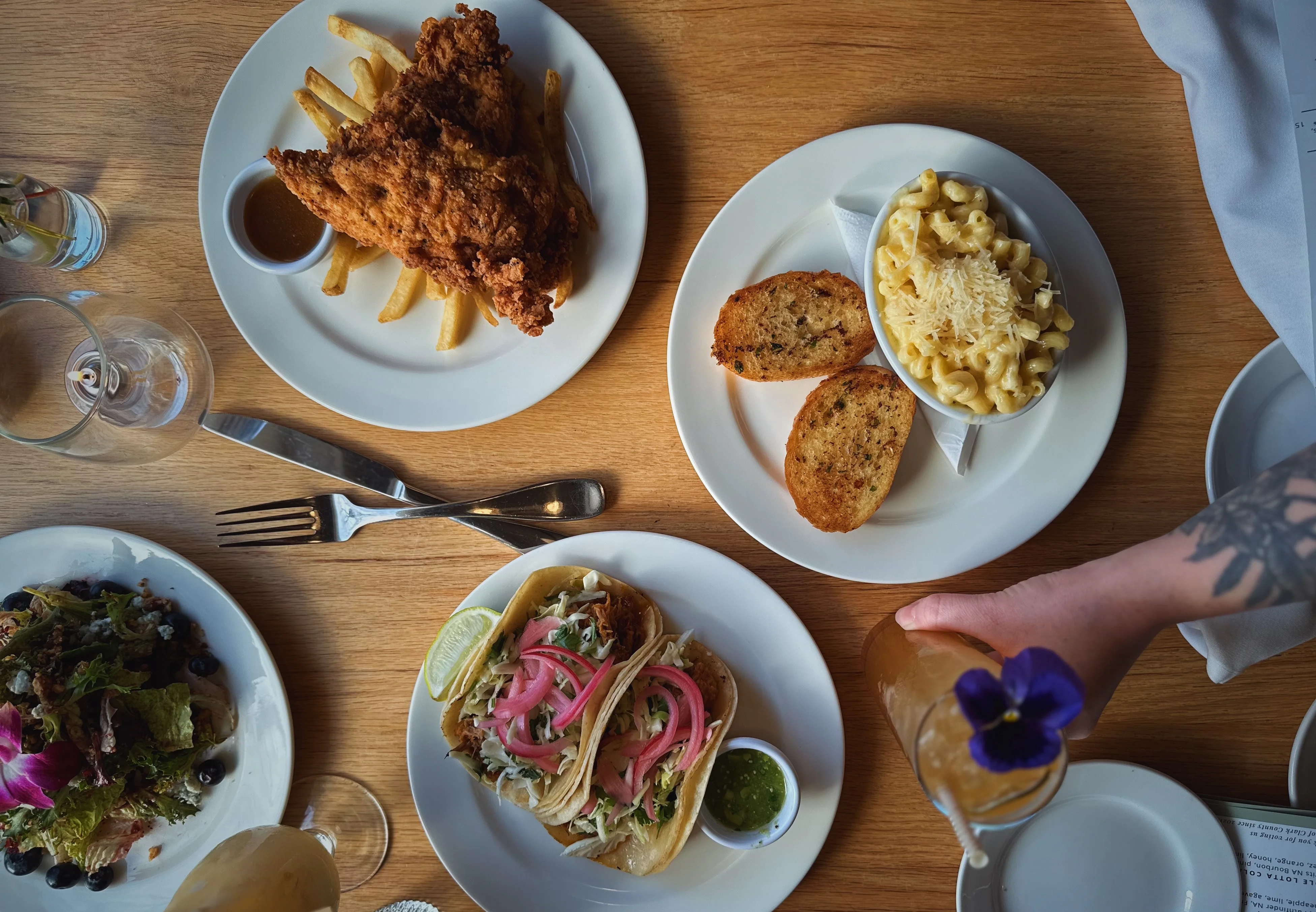 various happy hour plates of food