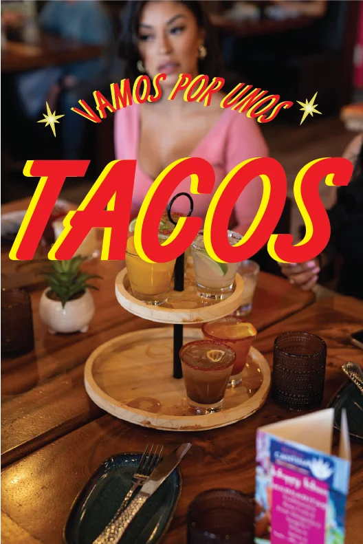 Colorful cocktails served on a tiered wooden tray at a Mexican restaurant