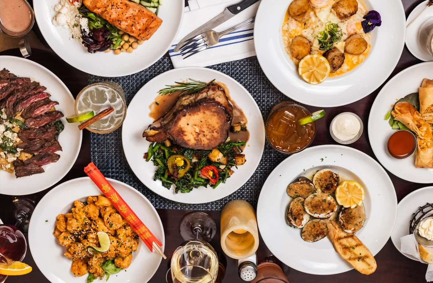 Assorted gourmet dishes including grilled salmon and pork chop