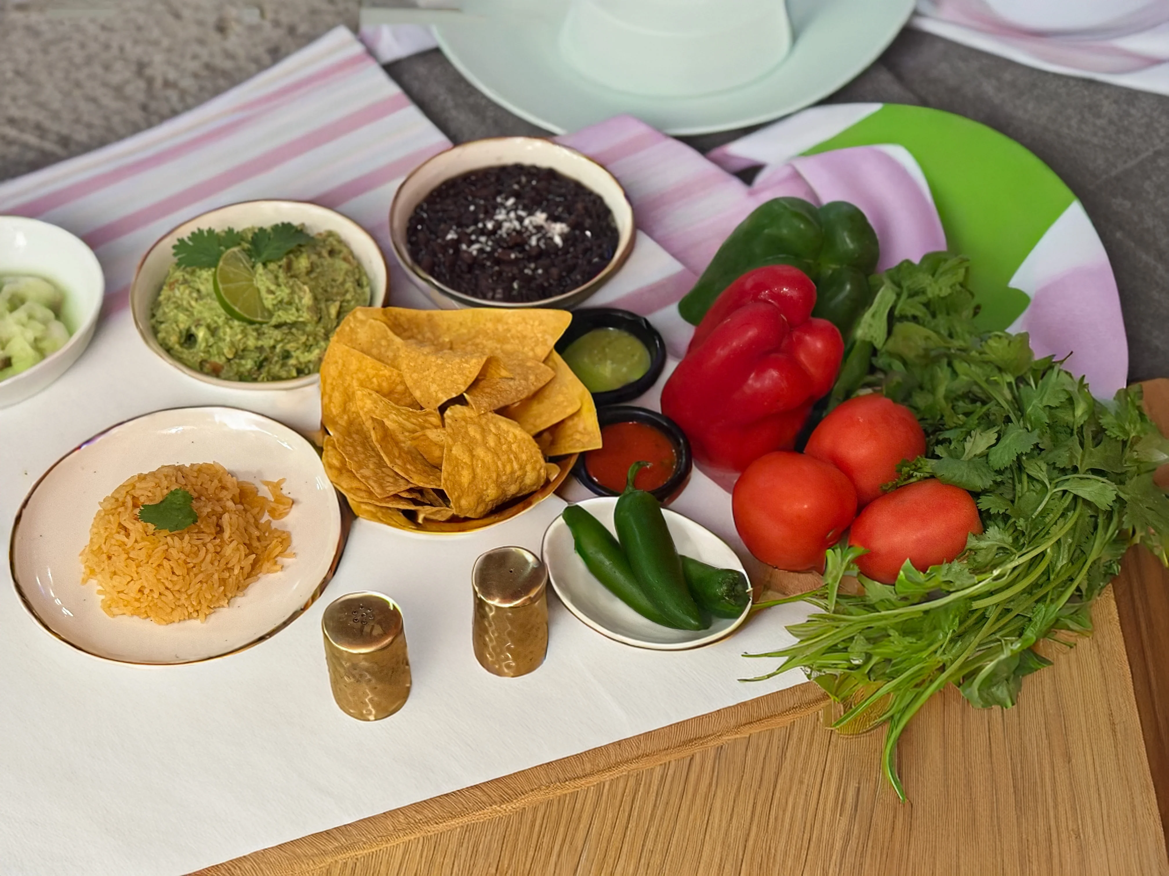 Colorful Mexican taco platter with guacamole and fresh toppings