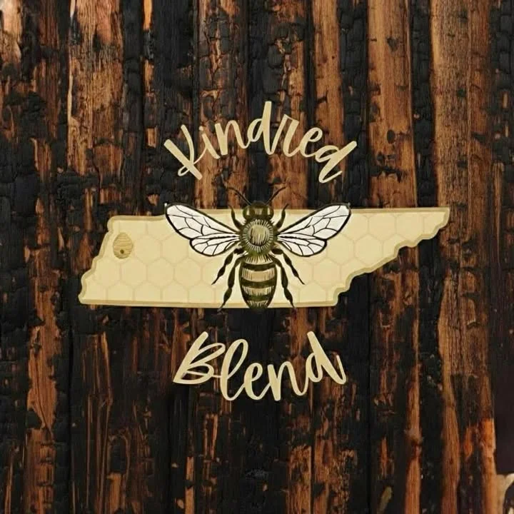 A decorative wooden sign shaped like the state of Tennessee featuring a bee design and the text 'Kindred Blend'.