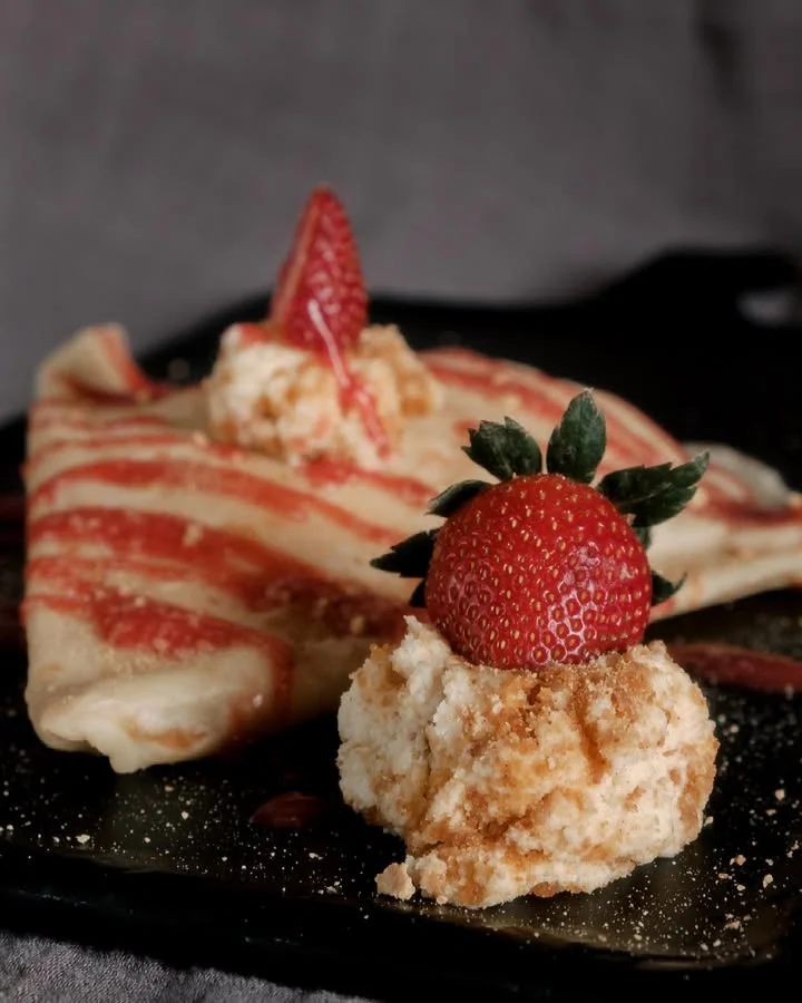 Delicious French crêpe with strawberries and cream