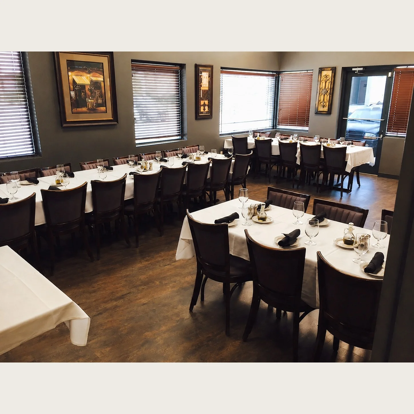 Elegant restaurant dining area with neatly arranged tables and warm lighting