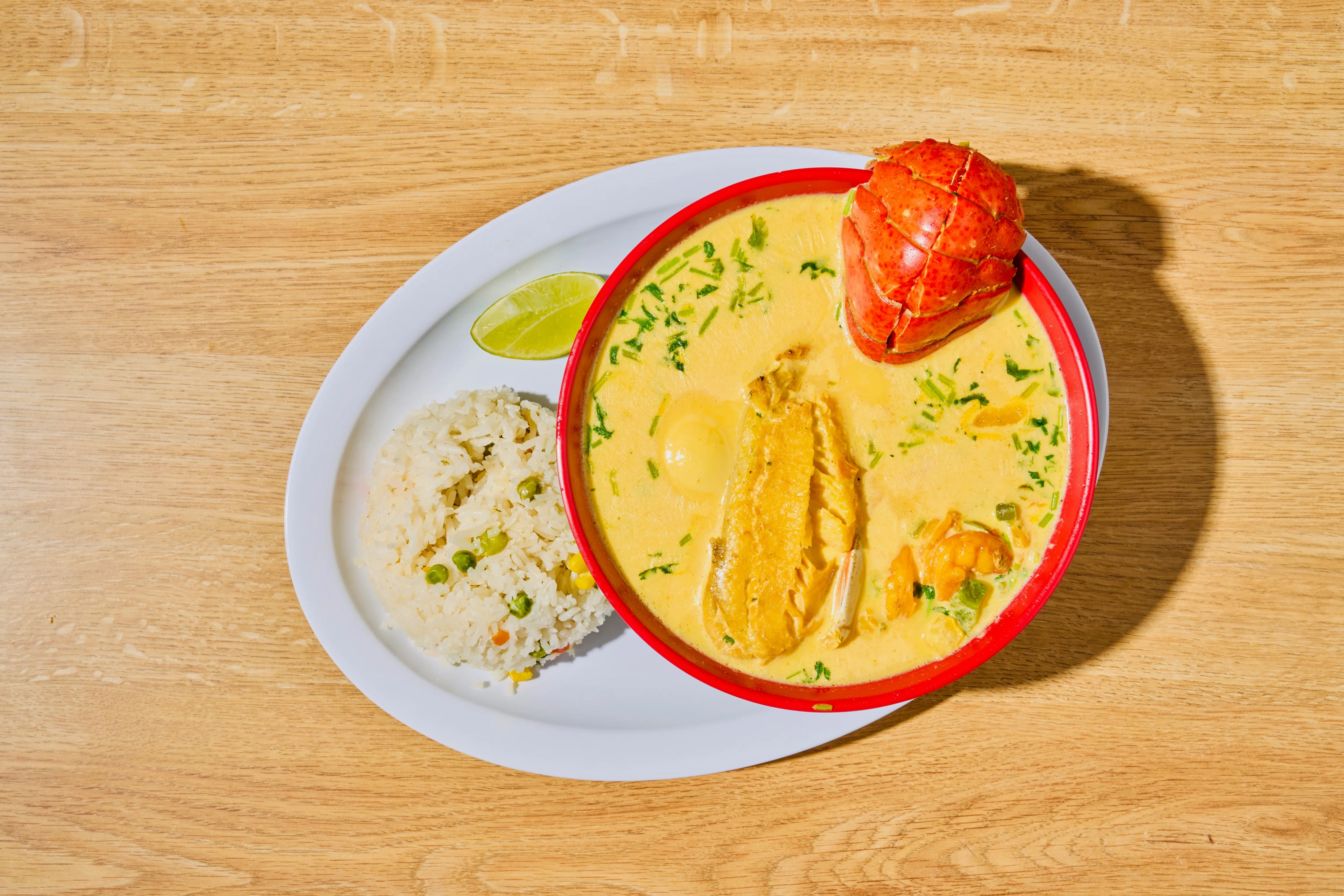 Delicious Caribbean fish curry with rice and lobster