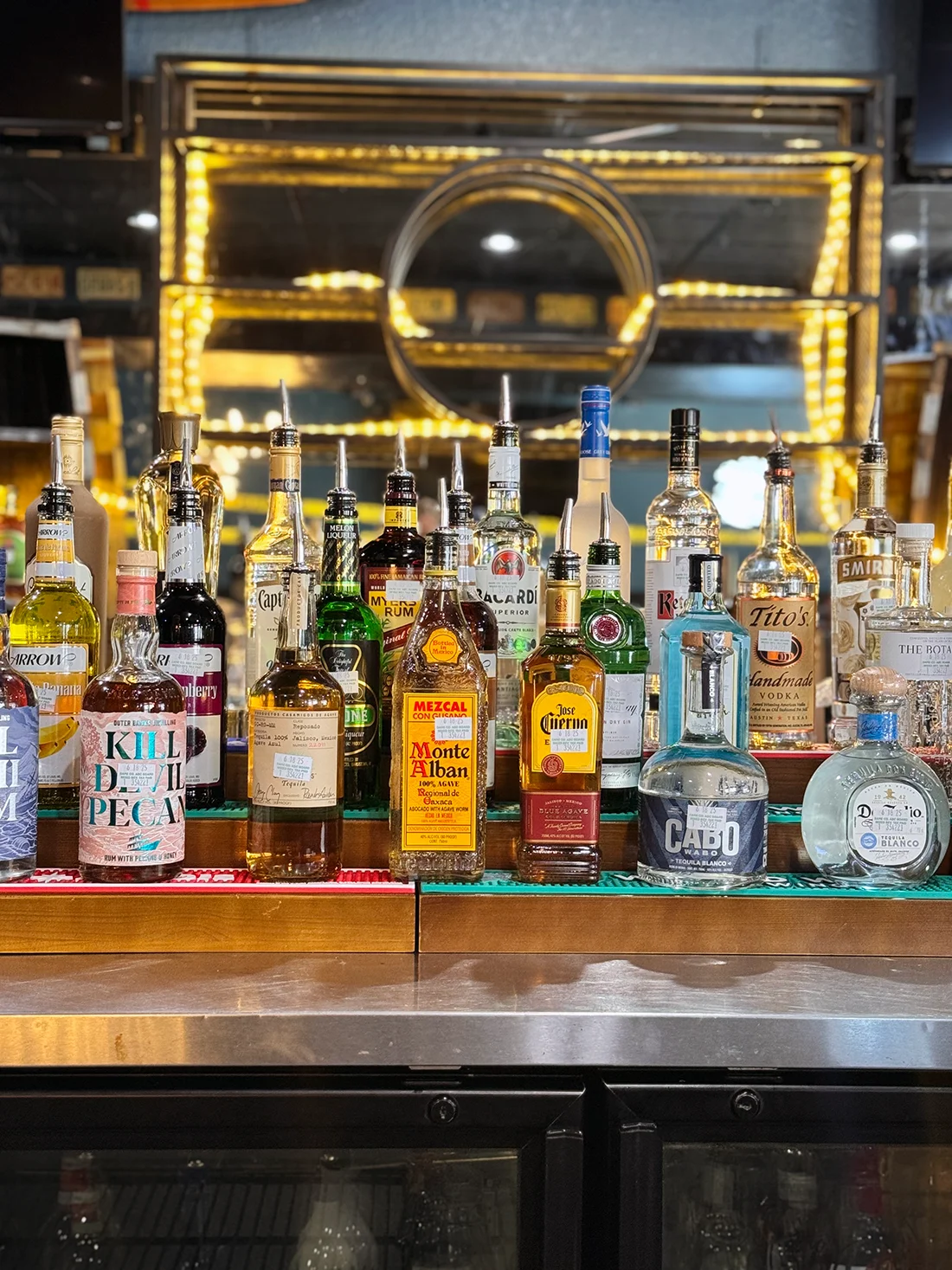 Well-stocked bar with various spirits and liquors