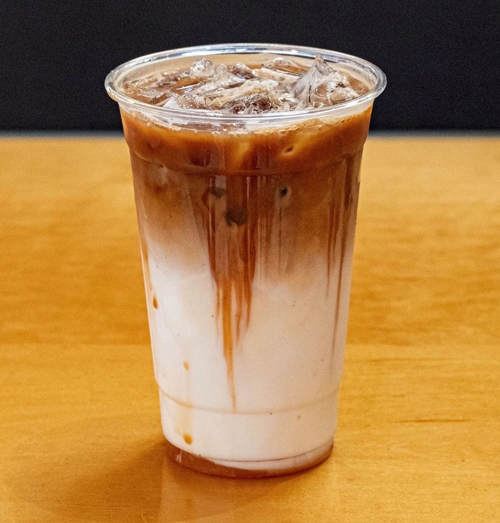 Iced coffee with milk and ice in a clear cup