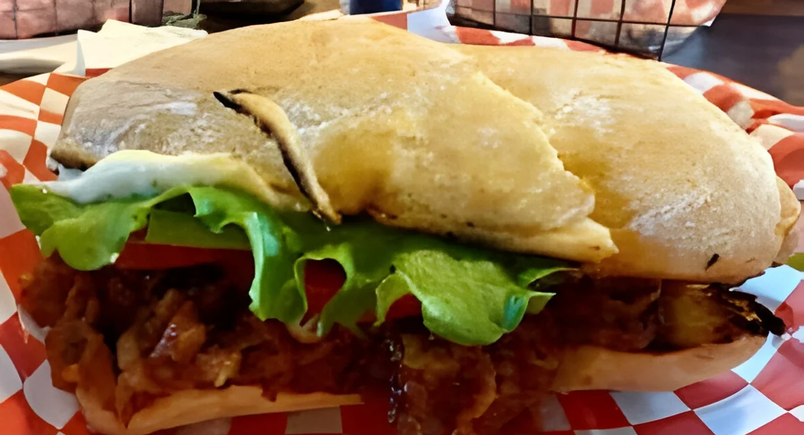 Delicious gourmet burger with fresh toppings on a wooden table
