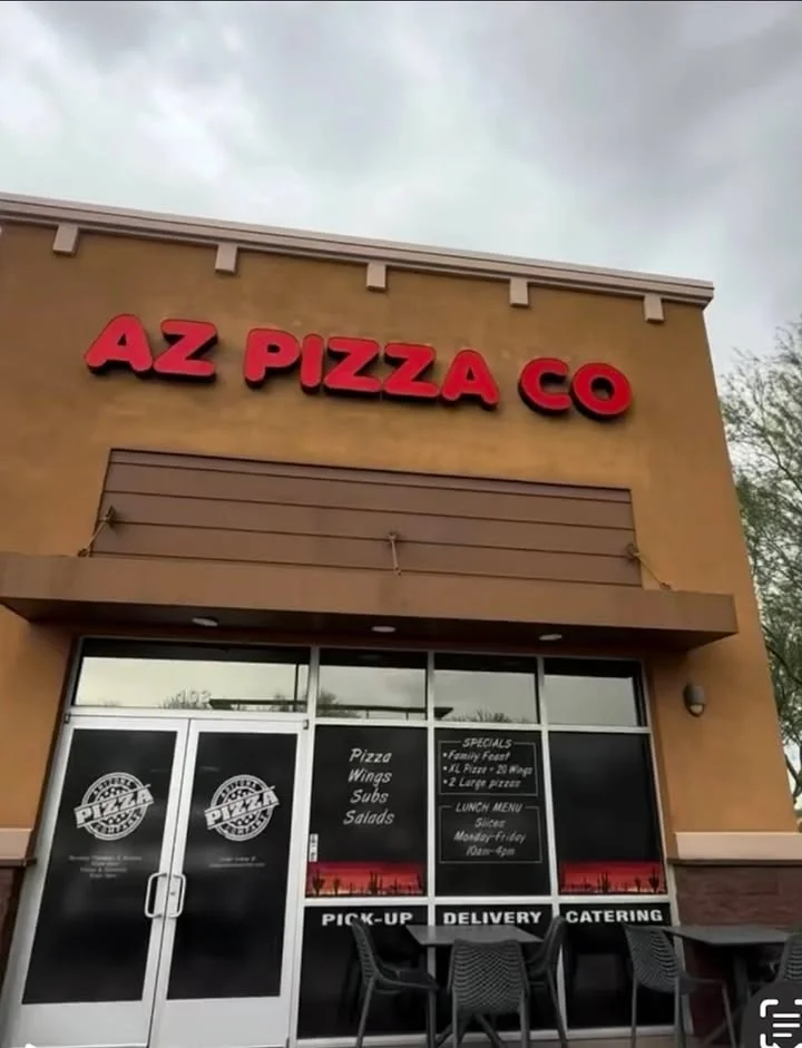 Exterior of AZ Pizza Co restaurant with signage