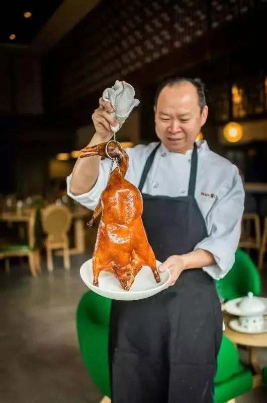 A restaurant chef preparing a dish