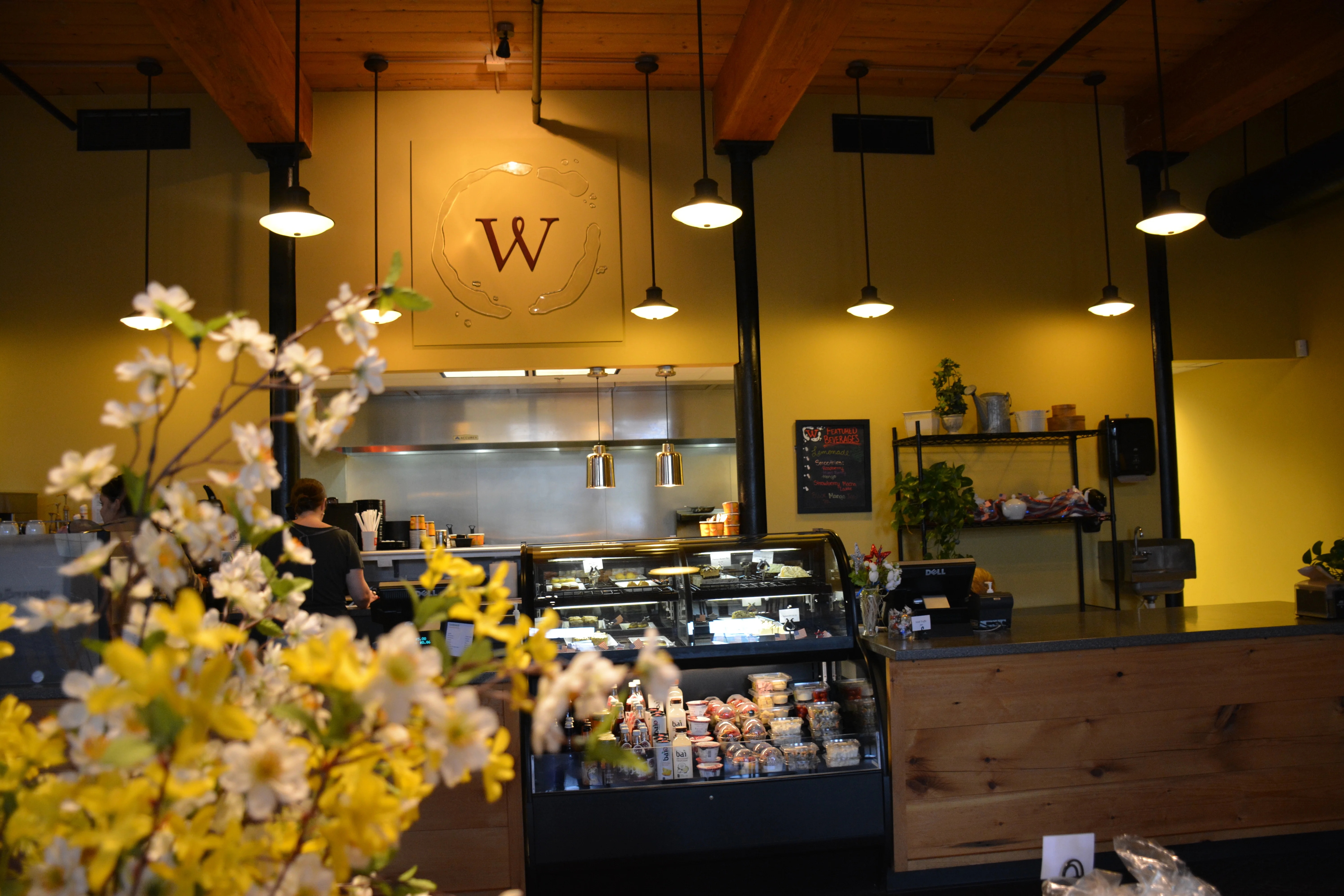 Cozy café interior with wooden accents and floral decor