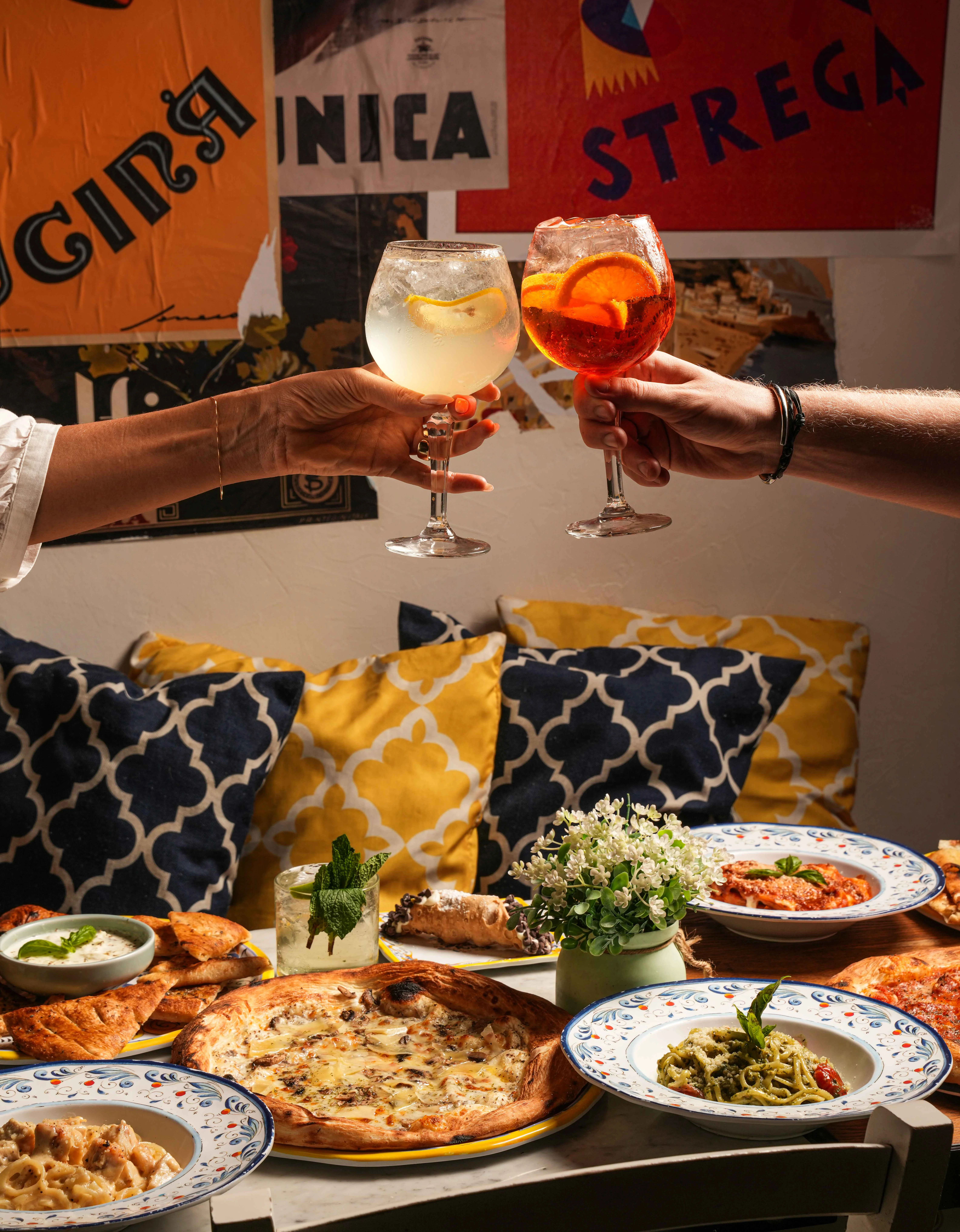 Cheers with cocktails in a vibrant restaurant setting