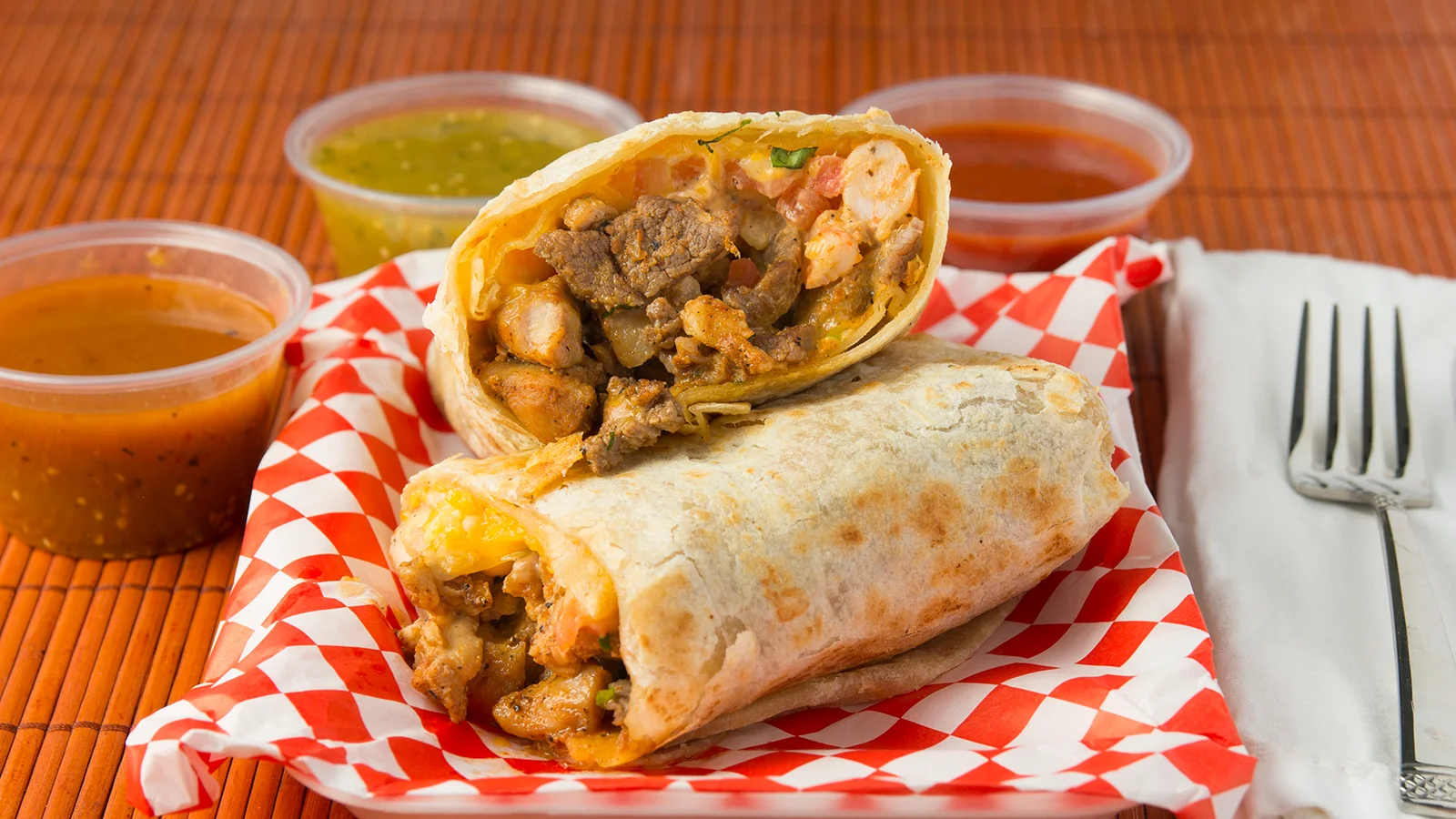 Delicious burritos with grilled meats and salsas