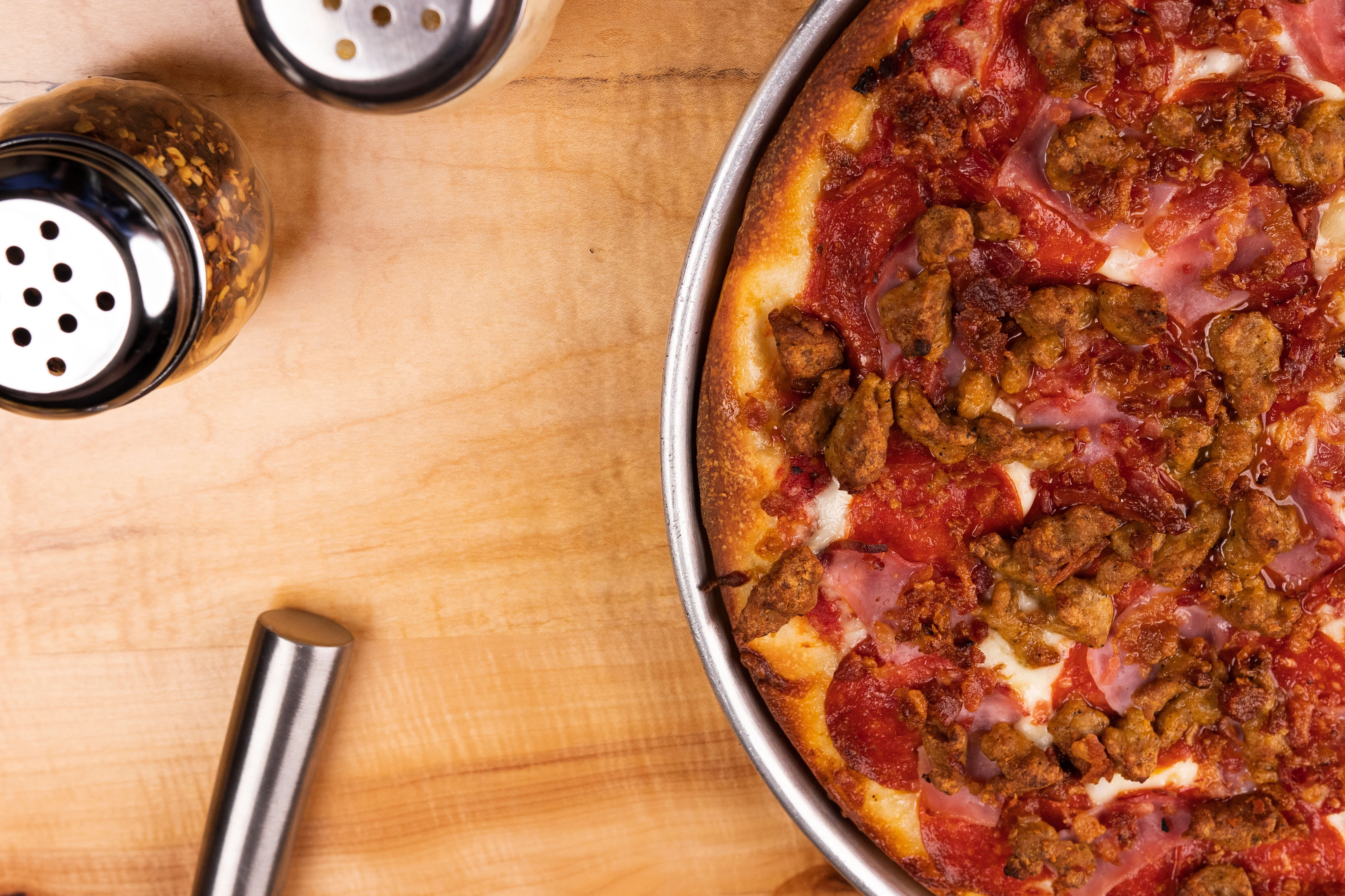 Delicious pepperoni pizza topped with savory sausage