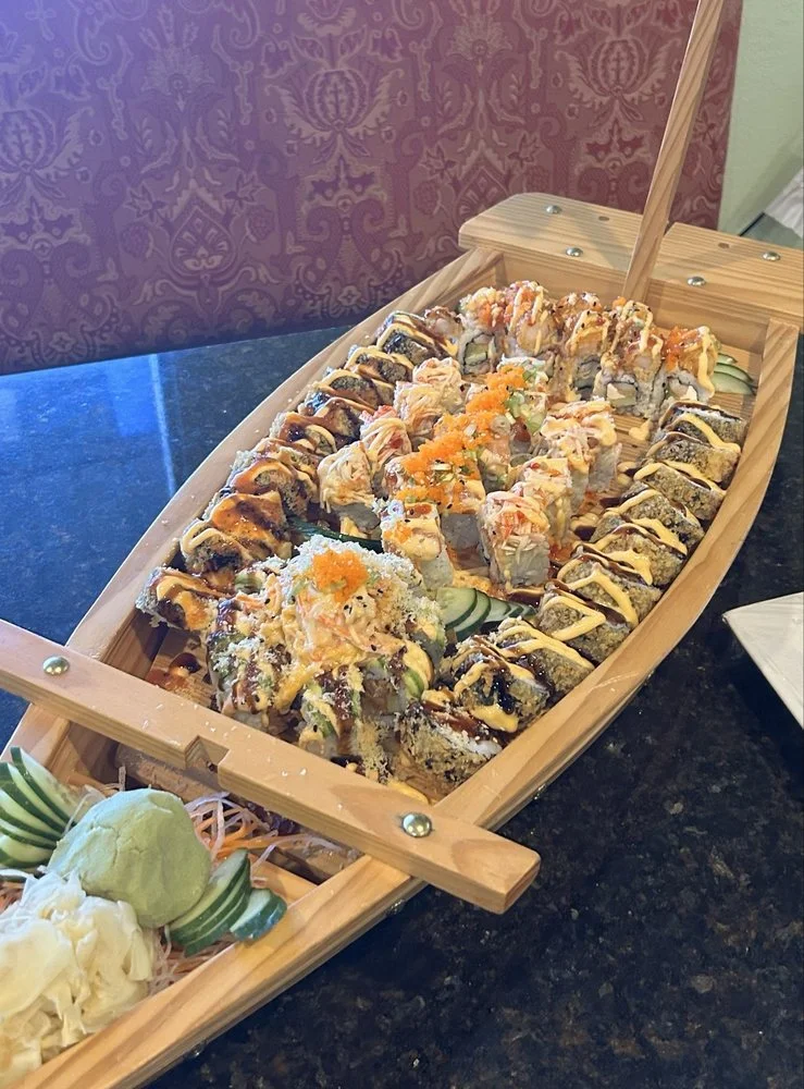 Assorted sushi platter served on a wooden boat