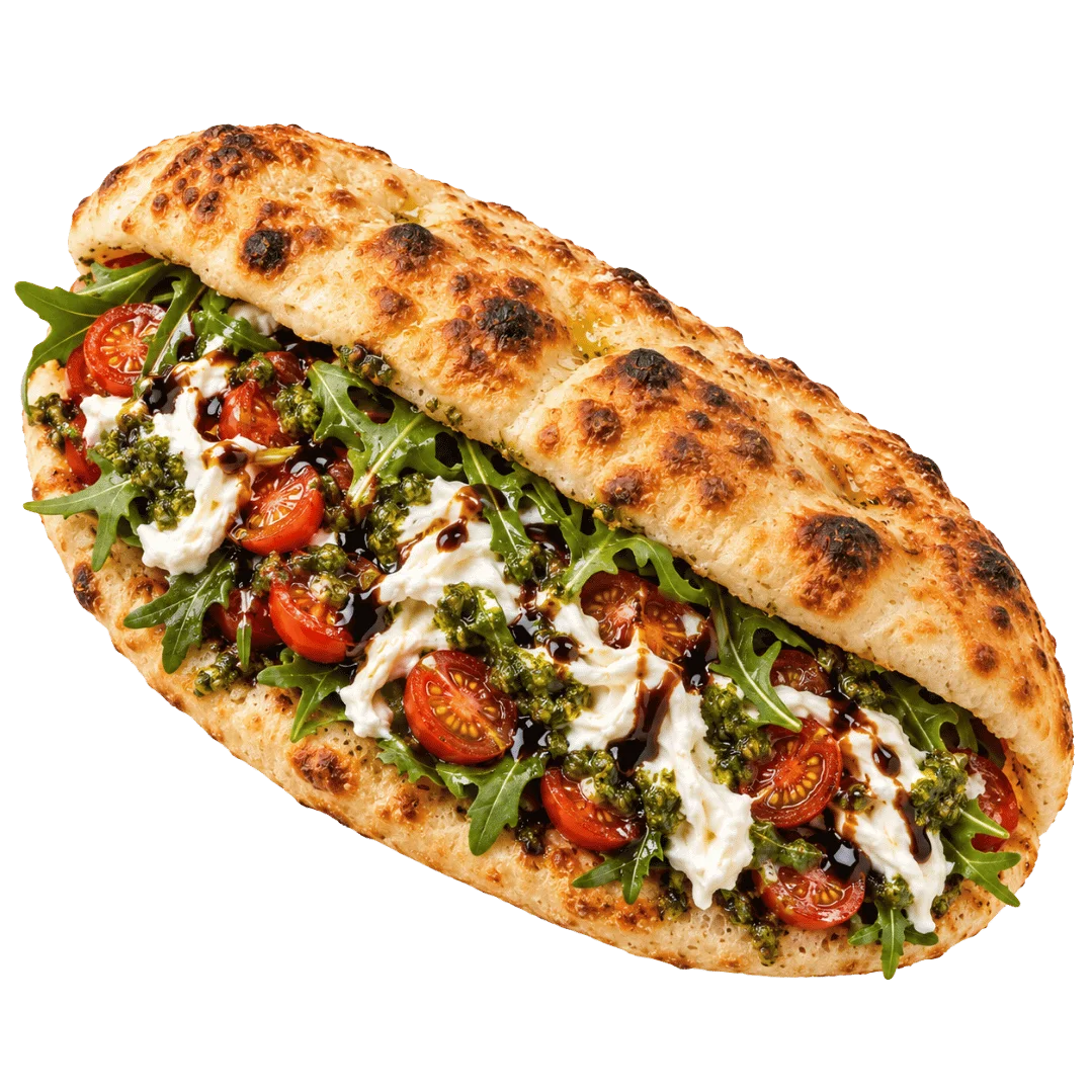 Italian caprese panino with mozzarella, tomatoes, pesto, and arugula
