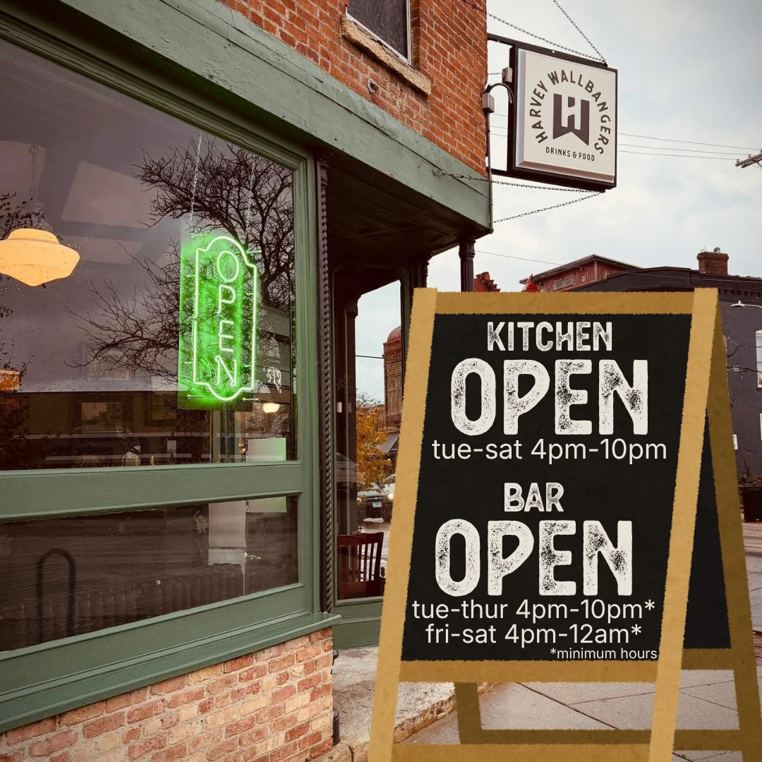 Harvey's restaurant hours poster with days and times listed.