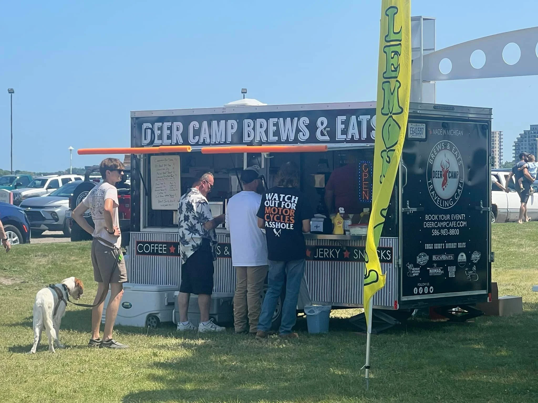 Food truck serving coffee and snacks at a lively outdoor event