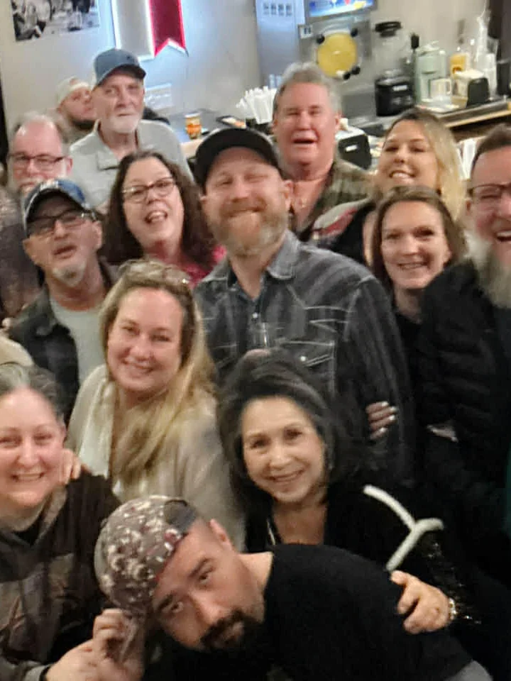 Group of friends enjoying a lively gathering at a restaurant
