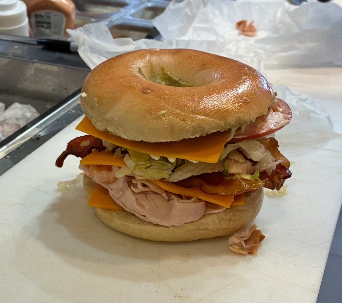 Loaded bagel sandwich with turkey and bacon